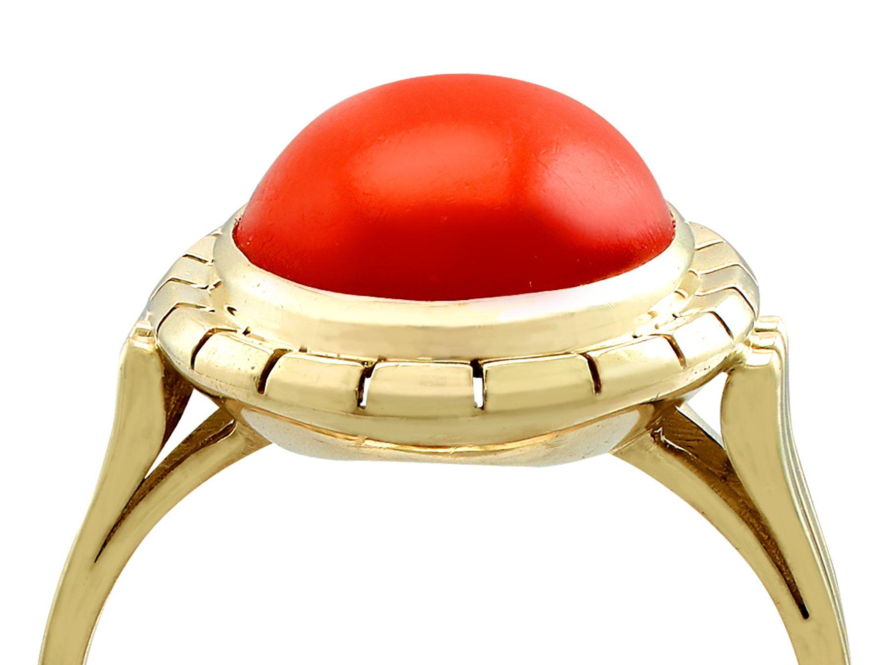 An impressive vintage 1940s 4.84 carat red coral and 14 karat yellow gold cocktail ring; part of our diverse gemstone jewelry and estate jewelry collections

This fine and impressive cabochon cut coral ring has been crafted in 14k yellow gold.

The