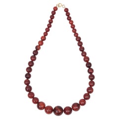 Collar vintage de los años 40, estilo Art Déco, con cuentas de baquelita, en tonos rojo burdeos