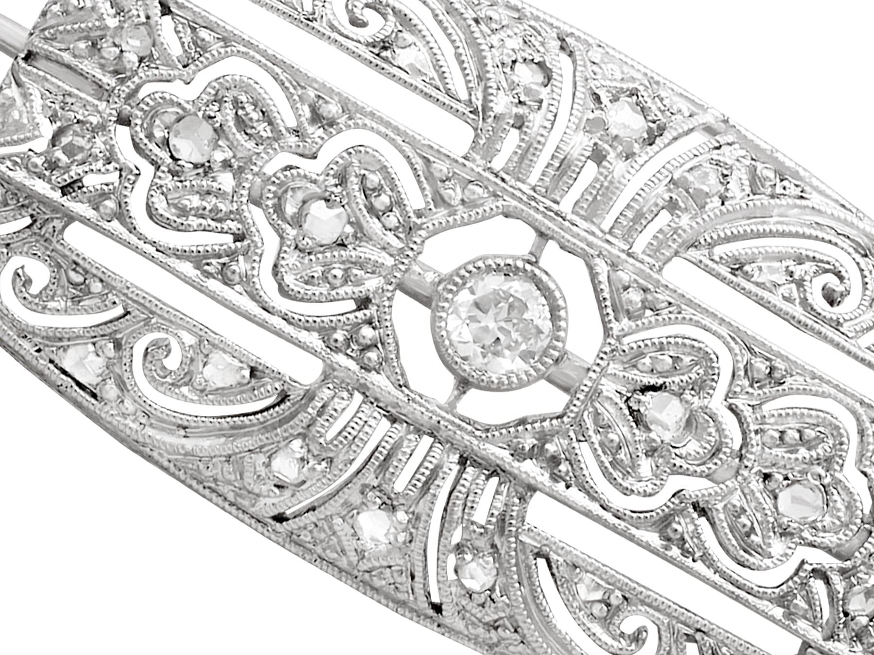 An impressive vintage Art Deco style 0.27 Carat diamond and 18 karat white gold brooch; part of our diverse vintage jewelry and estate jewelry collections.

This fine and impressive diamond brooch has been crafted in 18k white gold.

The oval shaped