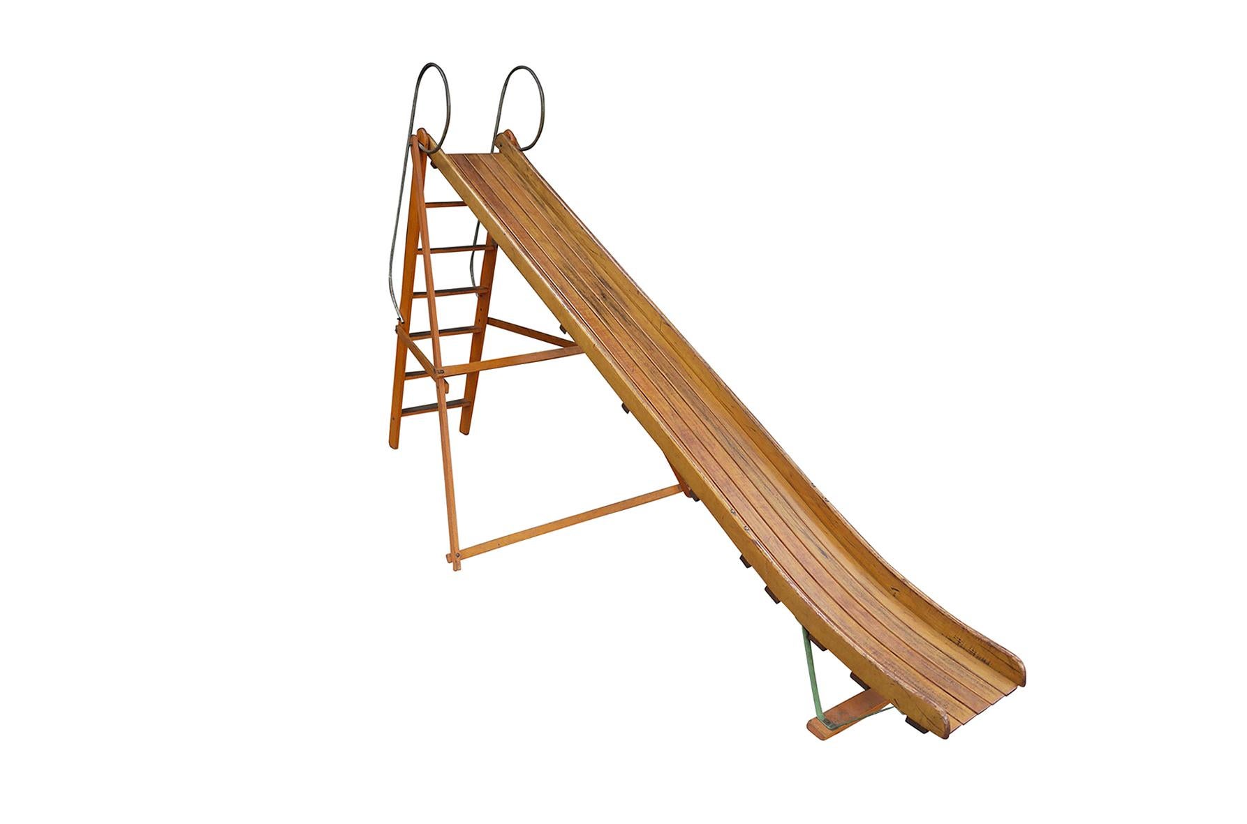 Vintage bent wood playground slide. Original finishes with even age appropriate patina. Was installed at one property since new. Can be used indoors or out.
____

We're offering our customers free domestic shipping on all items during the current