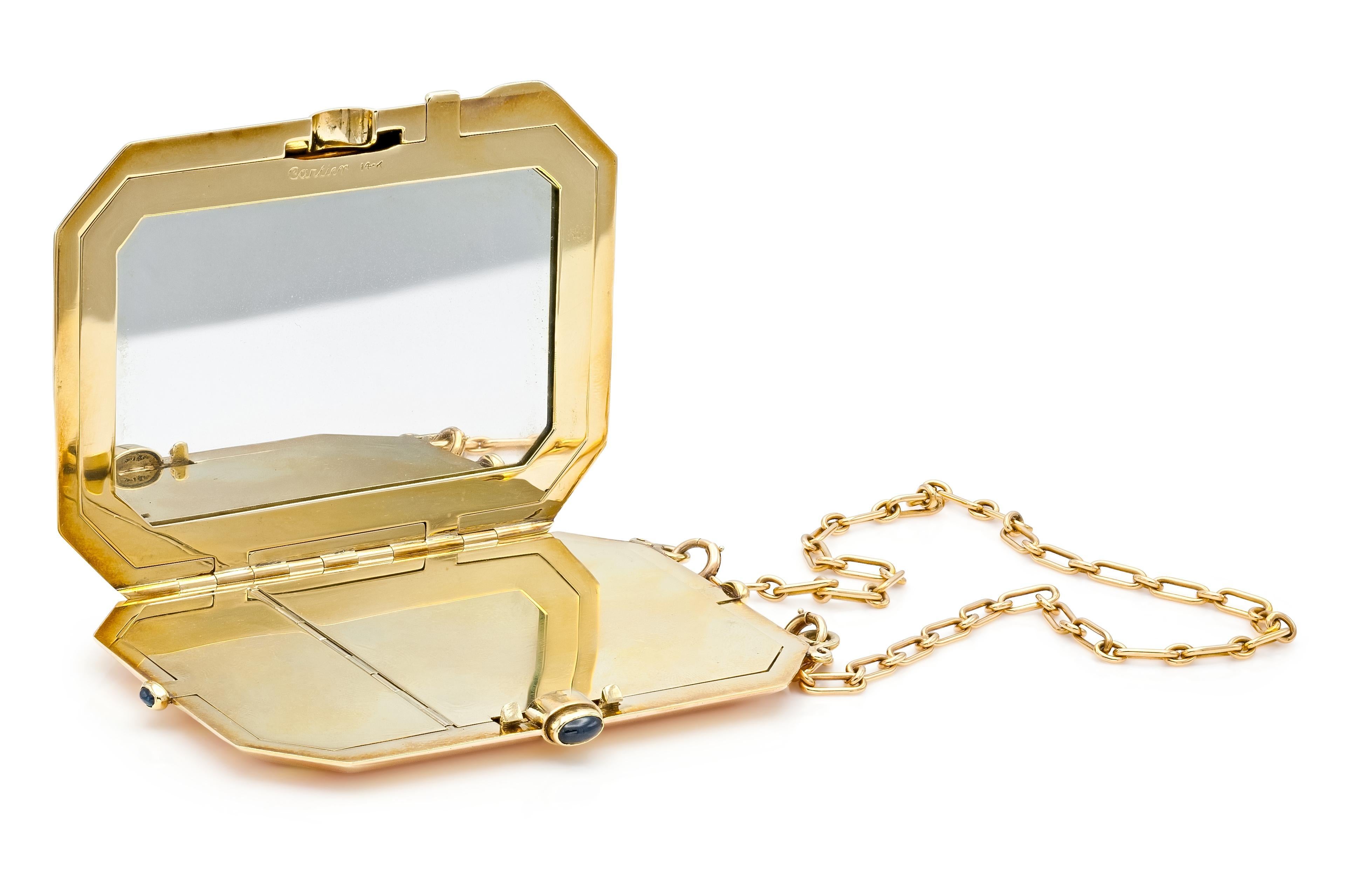 Finely crafted in 14k yellow and rose gold with a mirror and 3 blue Cabochon Sapphires.
Circa 1940s  
2 1/4 x 3 inches
12 inch chain