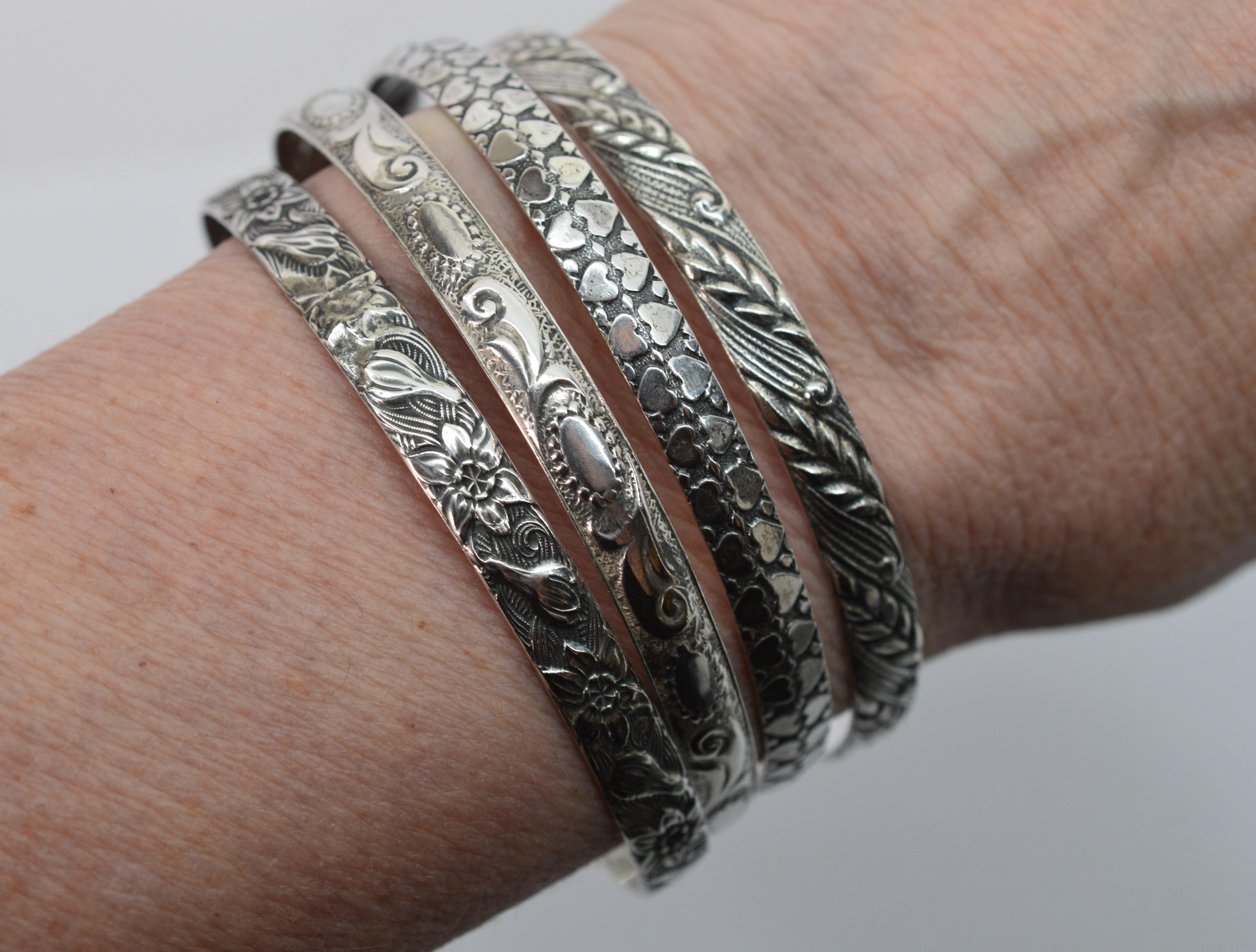 For lovers of fun, collectable silver jewelry pieces, this set of four vintage floral art deco patterned bangle bracelets is the perfect fit. Circa 1940 by maker Danecraft, Providence, Rhode Island 
this assembled set of four is stamped Danecraft