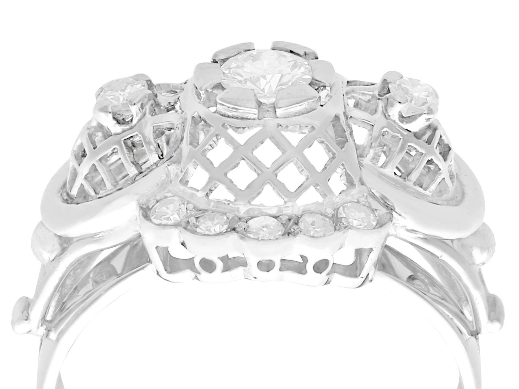 A fine and impressive vintage 0.49 carat diamond and 18 karat white gold cocktail ring; part of our diverse vintage jewelry and estate jewelry collections.

This fine and impressive cocktail ring has been crafted in 18k white gold.

The substantial,