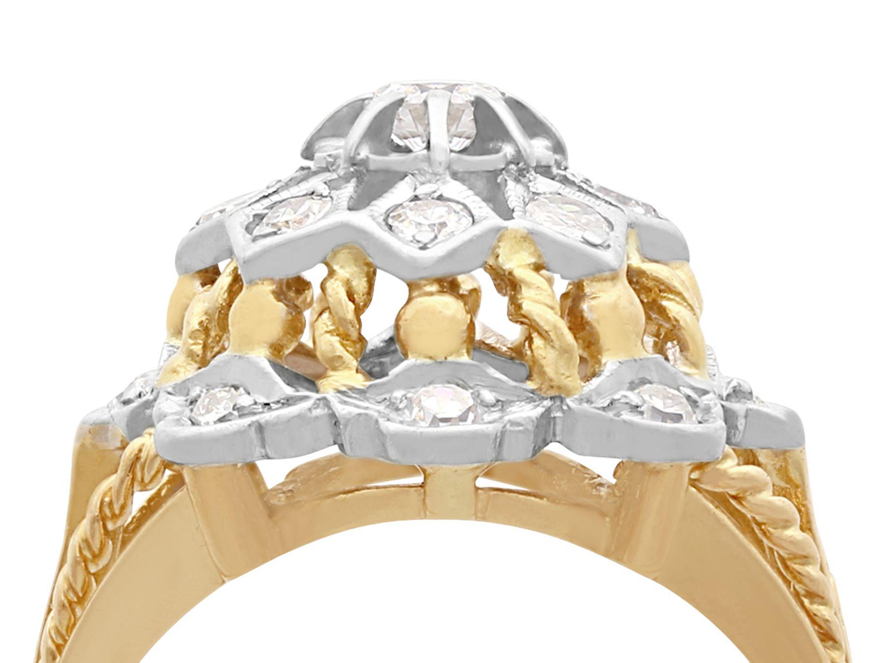 An impressive vintage European 0.70 carat diamond and 18 karat yellow gold, 18 karat white gold set cluster ring; part of our diverse antique diamond jewelry collections.

This fine and impressive vintage diamond cluster ring has been crafted in 18k