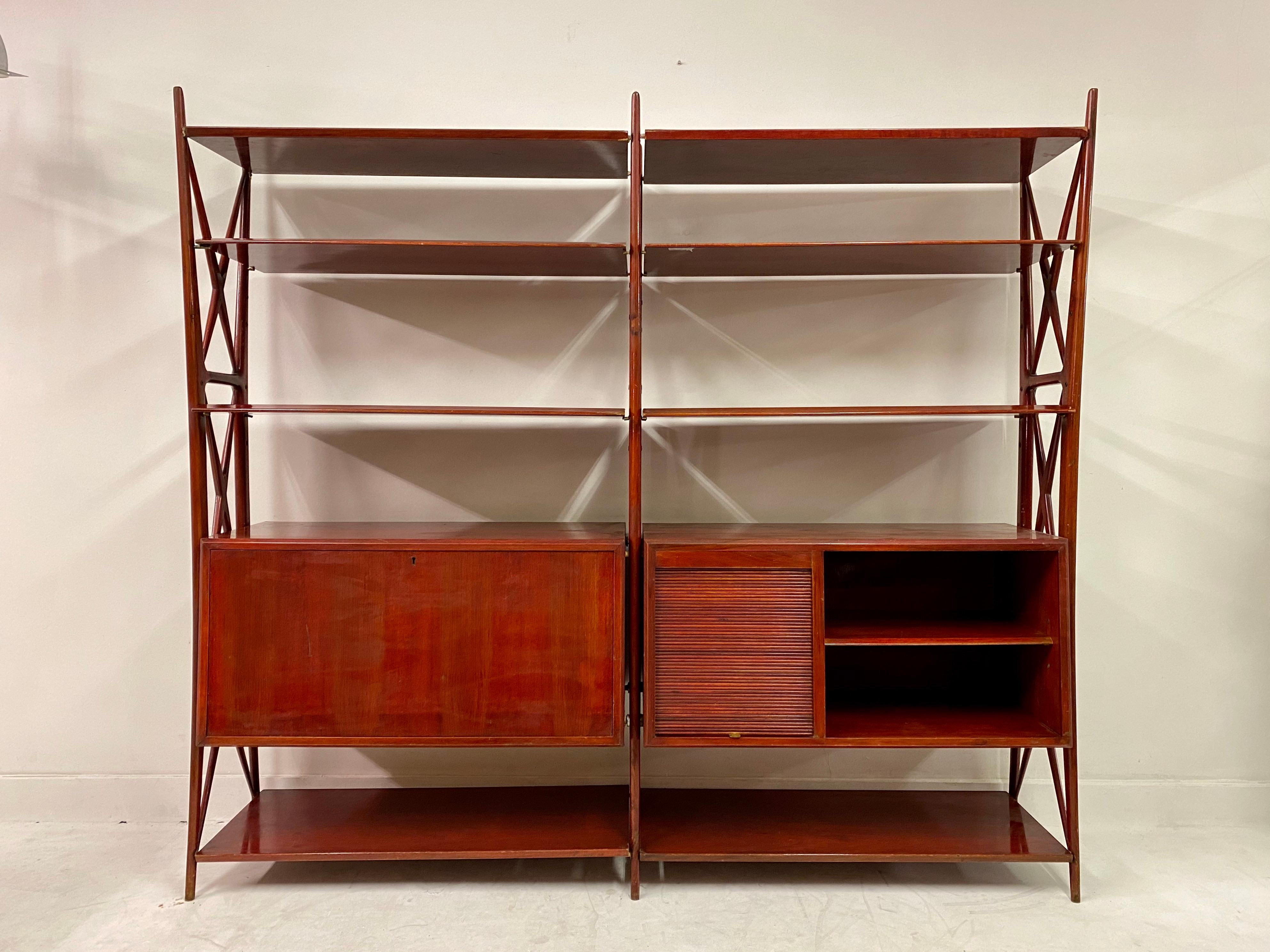 Shelving unit

By Silvio Cavartota

Italian walnut with red lacquer

Drop front and tambour door cabinets

Italy, circa 1948.

Il mobile Italiano degli Anni '40 e '50, Guttry and Maino, Pg 137 shows a similar example