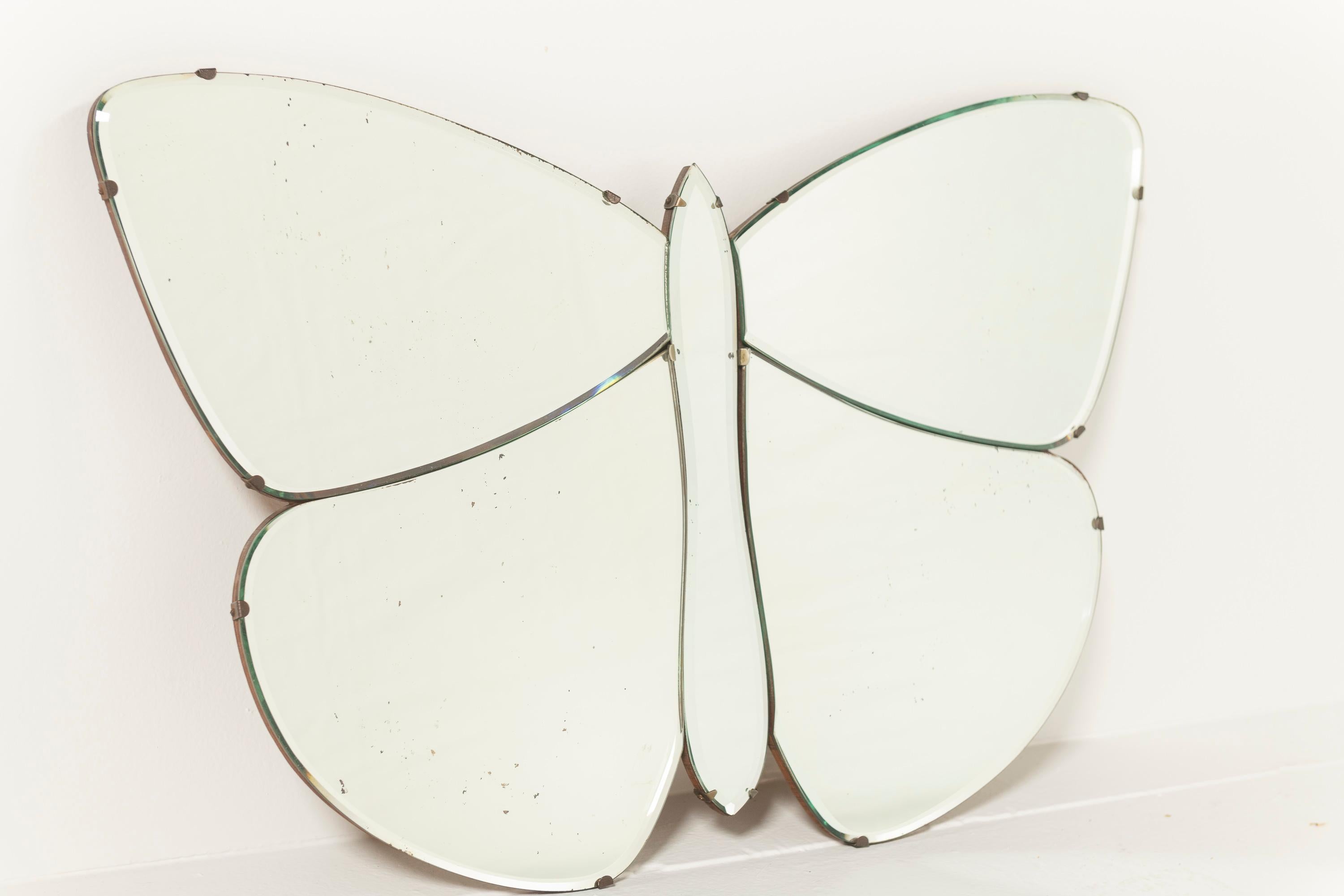 Sweet Vintage Italian Wall Mirror, Butterly, 1940s. The mirror is made of 5 separate pieces of cut mirror that are clamped and mounted on wood. Great mirror for a bit of whimsy and botanical influence. 