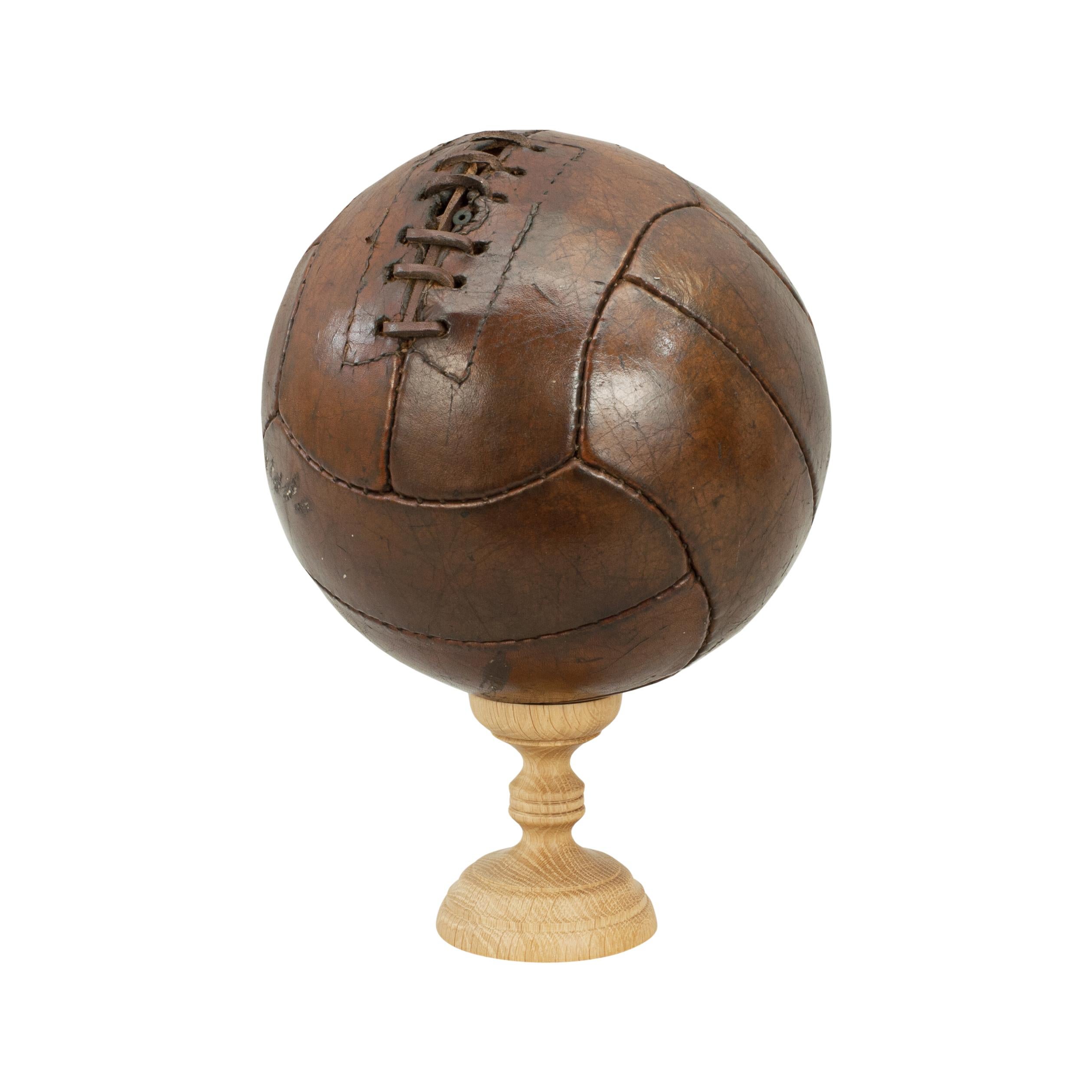 Vintage leather football.
A traditional 12-panel leather football in good condition. The ball has a lace-up slit to the top to enable bladder inflation.
  