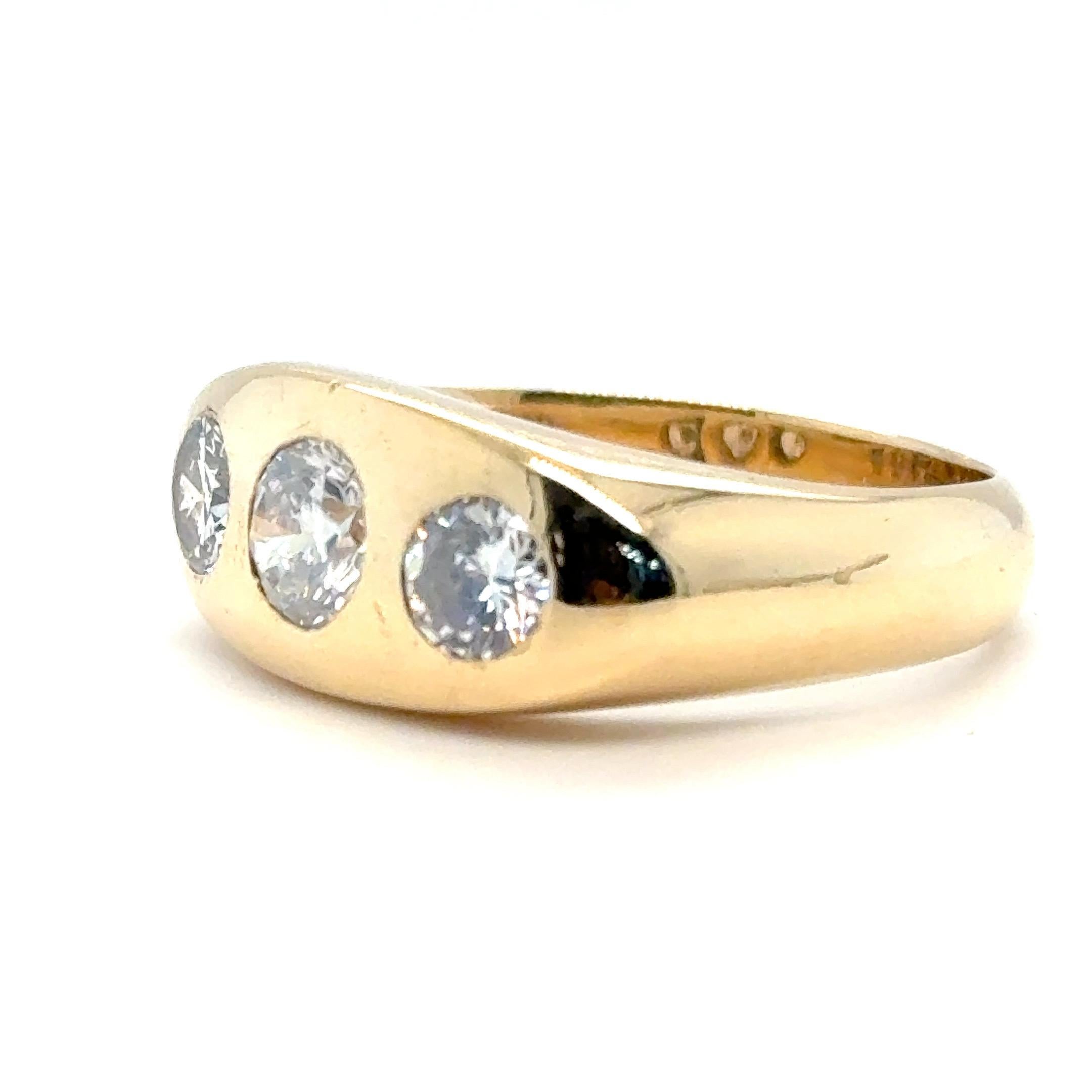 Vintage 1940s Old Cut Diamond Three Stone Ring in 18ct Yellow Gold

A beautiful vintage three stone ring featuring old European cut diamonds, crafted in rich 18ct yellow gold. The central diamond is the largest of the trio, flanked by two slightly