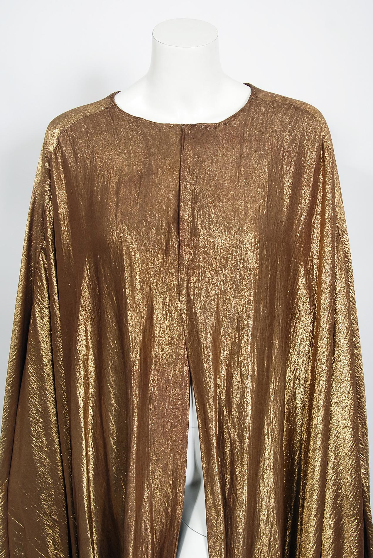 A breathtaking metallic gold lamé custom-made Paramount Pictures full length trained cape dating back to the early 1940's. This gorgeous garment comes with certificate of authenticity so you can be sure this is a true piece of Old Hollywood history.