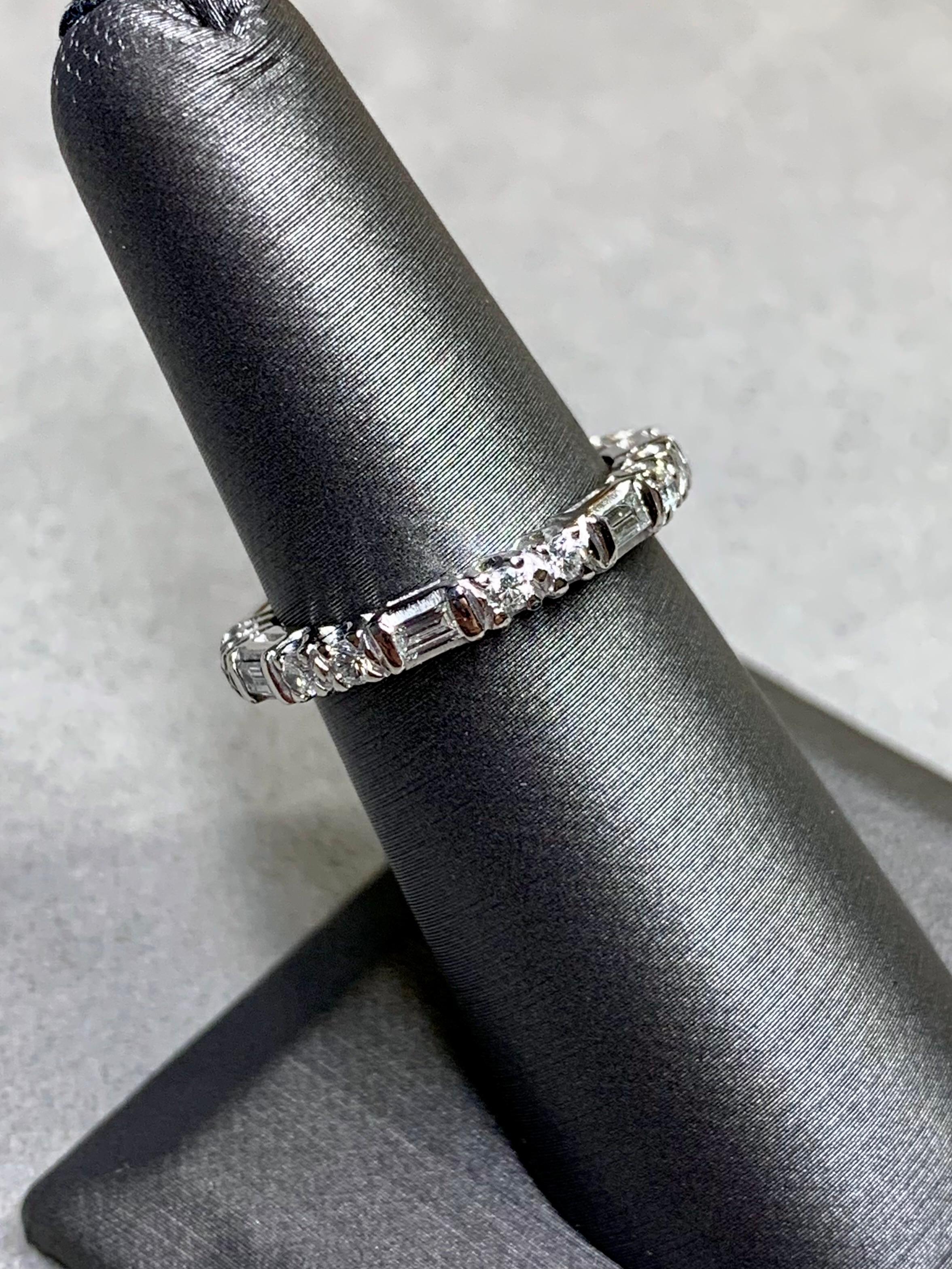 A beautifully made eternity band done in platinum original to the 1940’s. It is set with approximately .84ctw in H-J color Vs2-Si1 clarity round and baguette diamonds. A lovely piece of vintage jewelry history that is also everyday