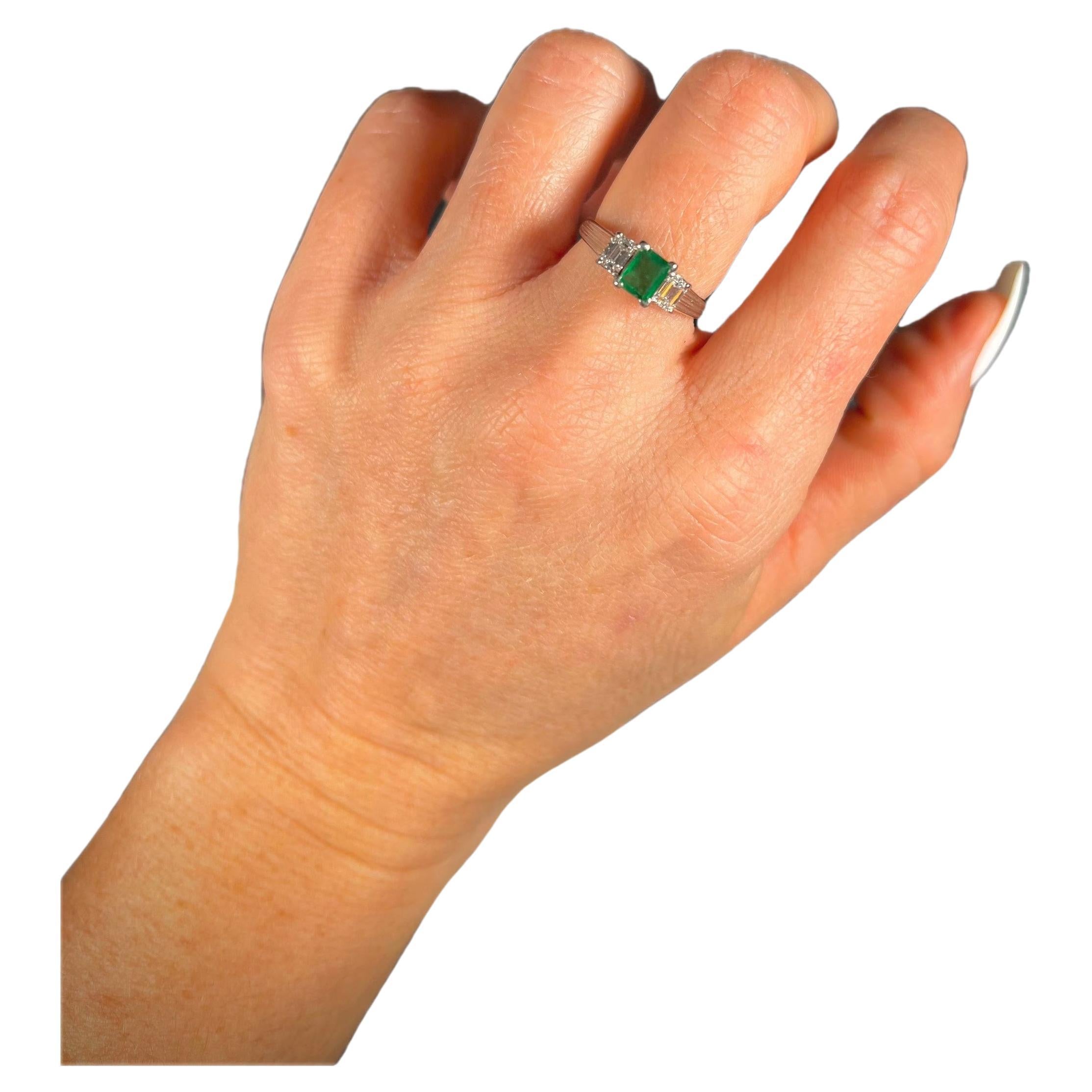 Vintage 1940’s Platinum Emerald & Diamond Three Stone Ring on a decorative band For Sale