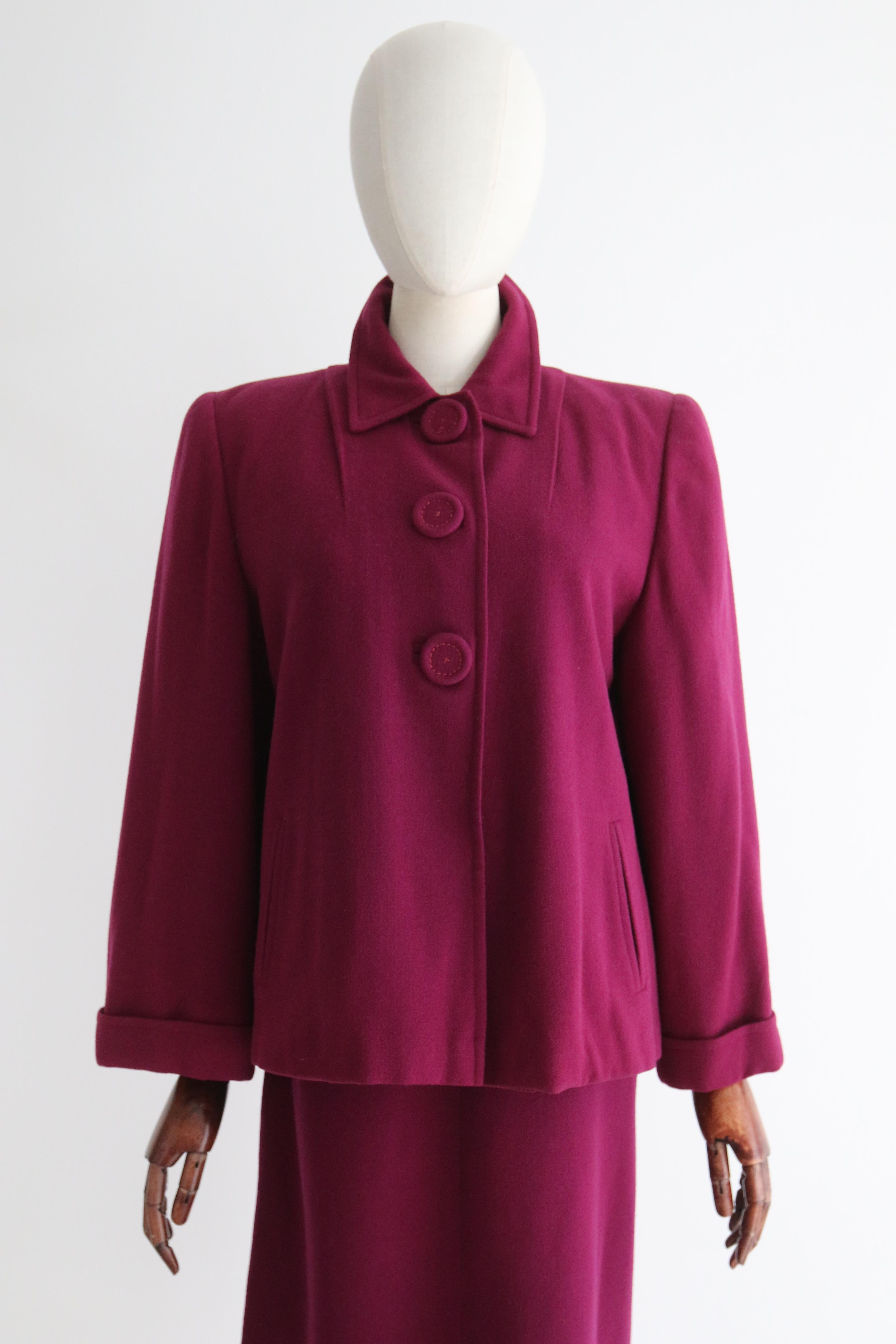 A classic silhouette rendered in a stunning pleasant plum  wool, this 1940's tailored three piece skirt suit is the perfect addition to your vintage wardrobe.

The rounded neckline of the jacket is framed by a pointed collar. The structured shoulder