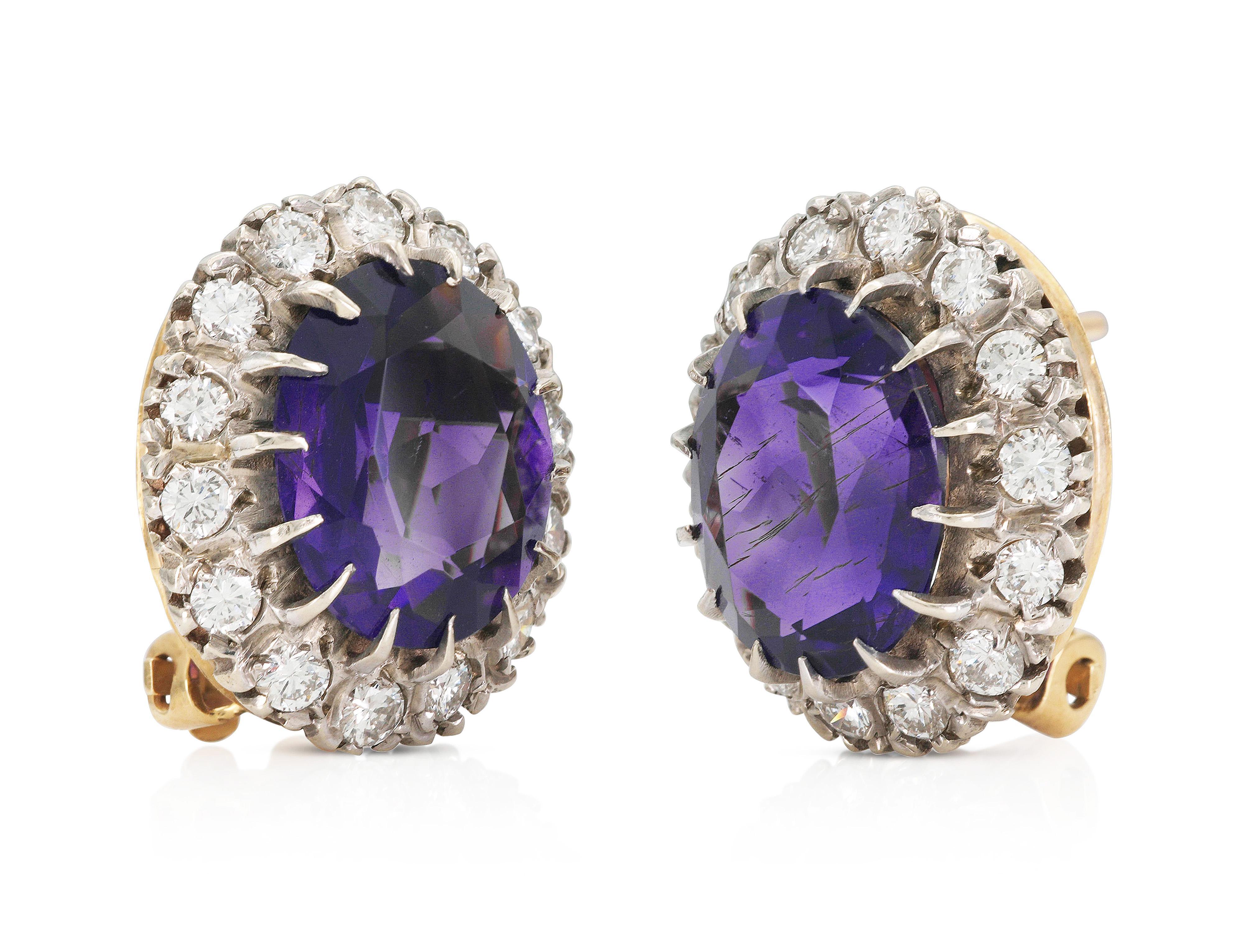 Finely crafted in 14k white and yellow gold with two Oval cut Amethysts weighing a total of approximately 10.00 carats, both surrounded by halos of Round Brilliant cut Diamonds weighing a total of approximately 1.40 carats.
Circa 1940s
11/16 x 5/8