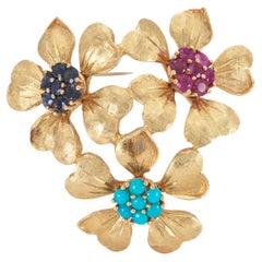 Vintage 1940s Retro Gold Drei-Blumen-Brosche mit mehrfarbigen Steinen