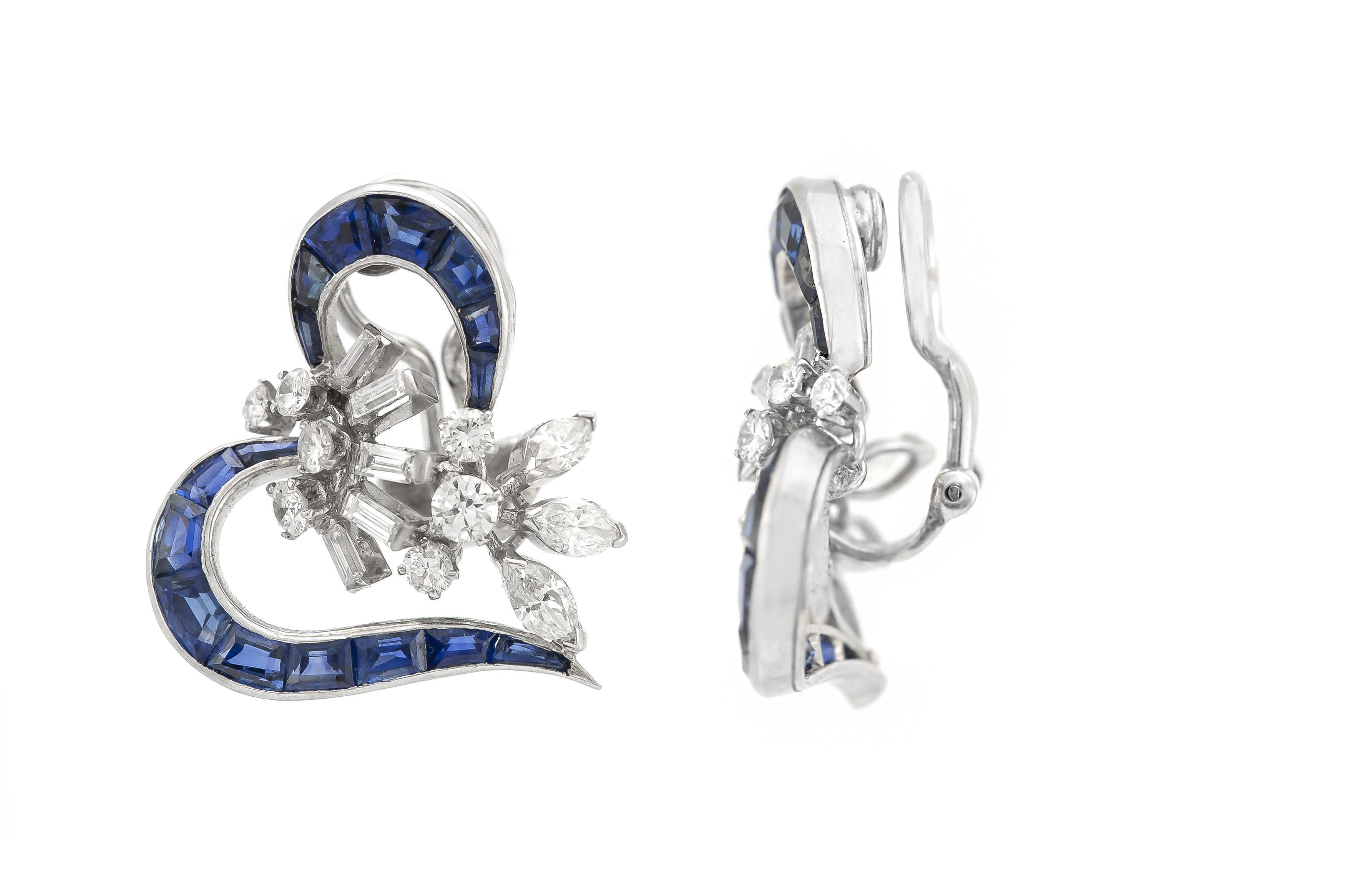 Finely crafted in platinum with channel-set Sapphires weighing a total of approximately 6.00 carats and Marquise, round Brilliant, and Baguette cut Diamonds weighing a total of approximately 2.00 carats.
Circa 1940s
7/8 inch length x 1 inch width