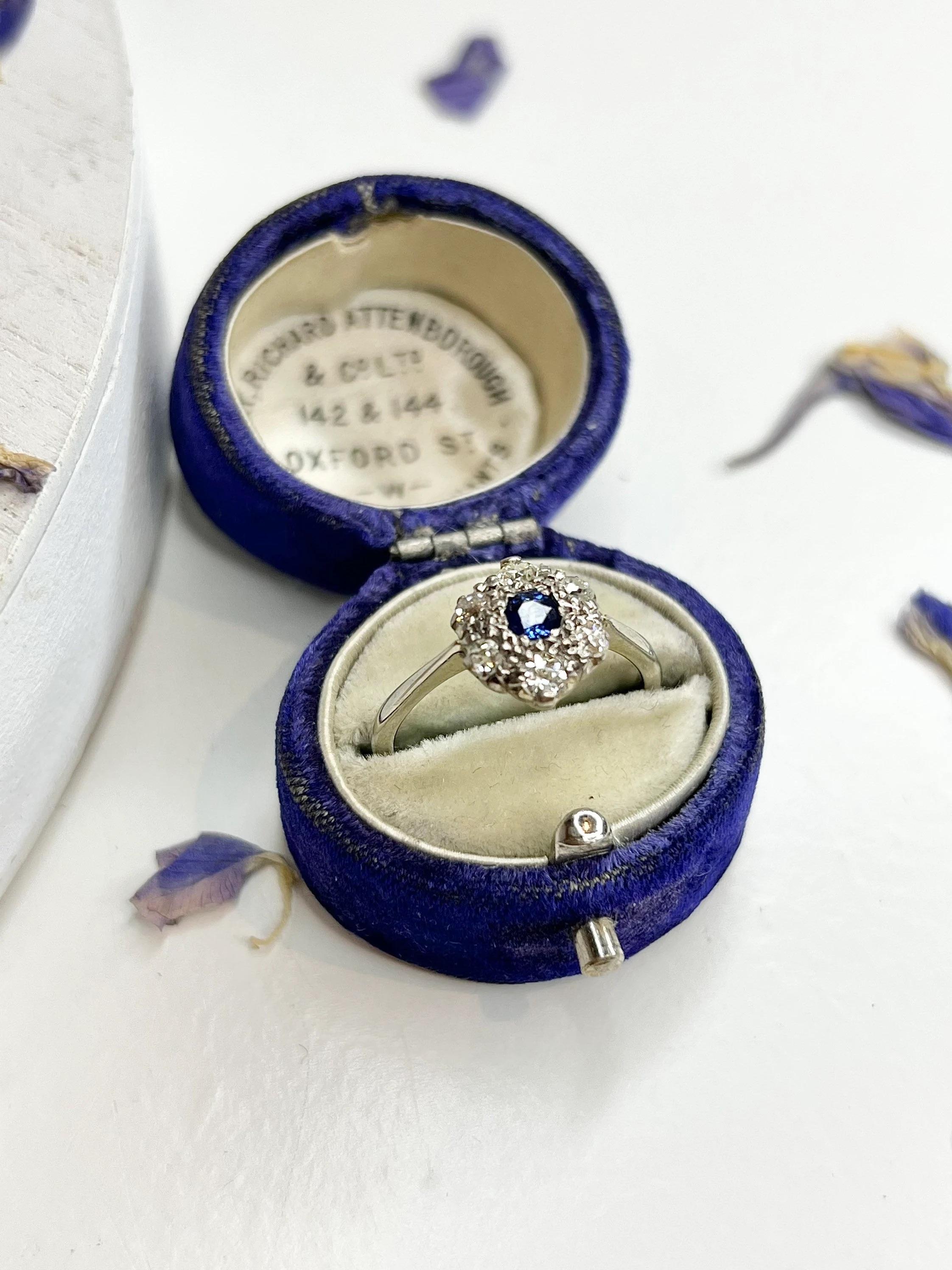 Vintage Daisy Ring 

Circa 1940’s

18ct White Gold 

Beautiful Daisy Style Ring Set with Natural Centre Sapphire & Cluster of Old Cut Diamonds 

Face of the ring measures 10.8mm x 10mm

Would make a lovely engagement ring! 

UK Size N

US Size