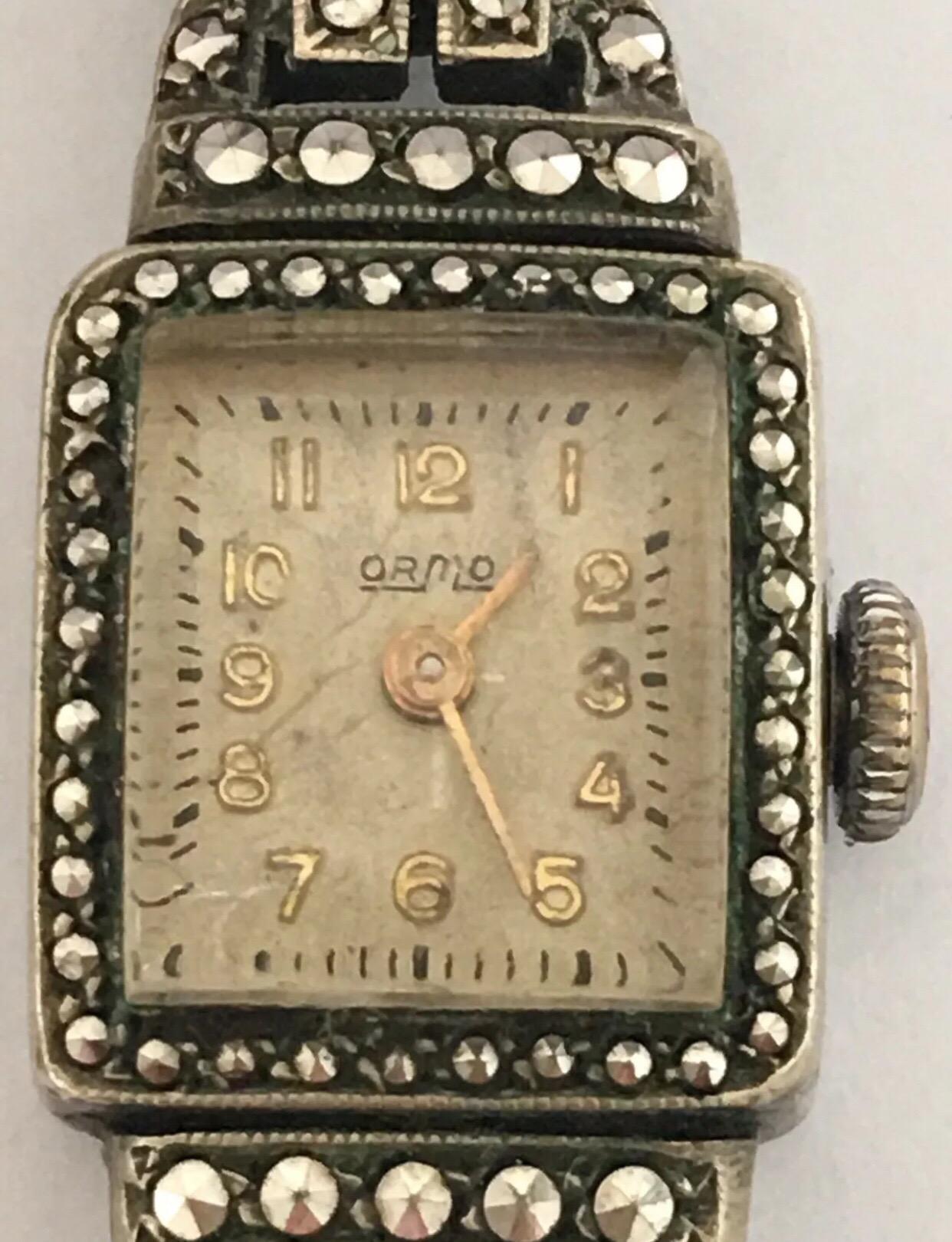 Vintage 1940’s Stainless Steel Marcaseed Ladies Cocktail Watch. This mechanical watch is working and running well.

Please study the photos carefully as form part of the description.