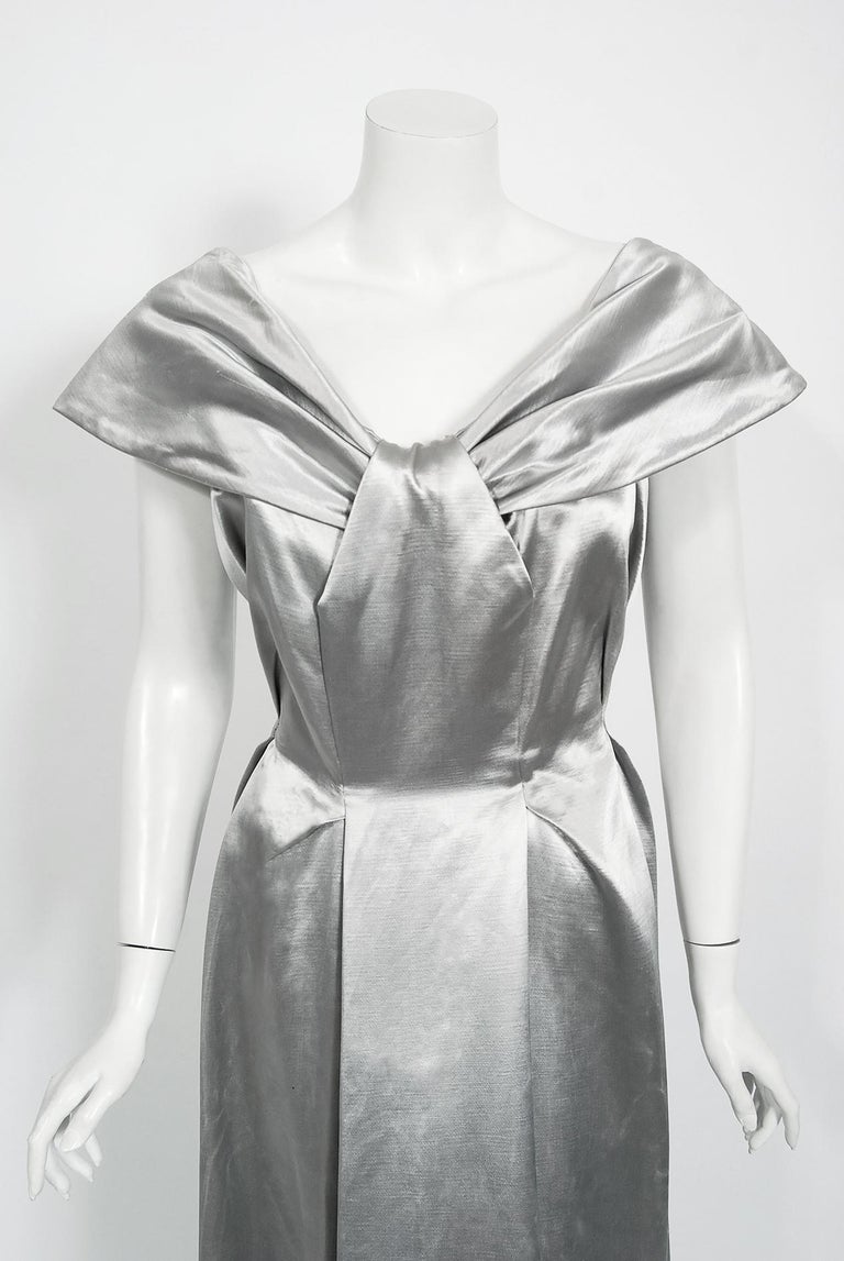 Enchanting ballgowns from the late 1940's era are perennial favorites and this silver showstopper is breathtaking. The garment's silver silk satin reads so modern yet the detailed structure is a treasure trove of Old Hollywood design. There is so