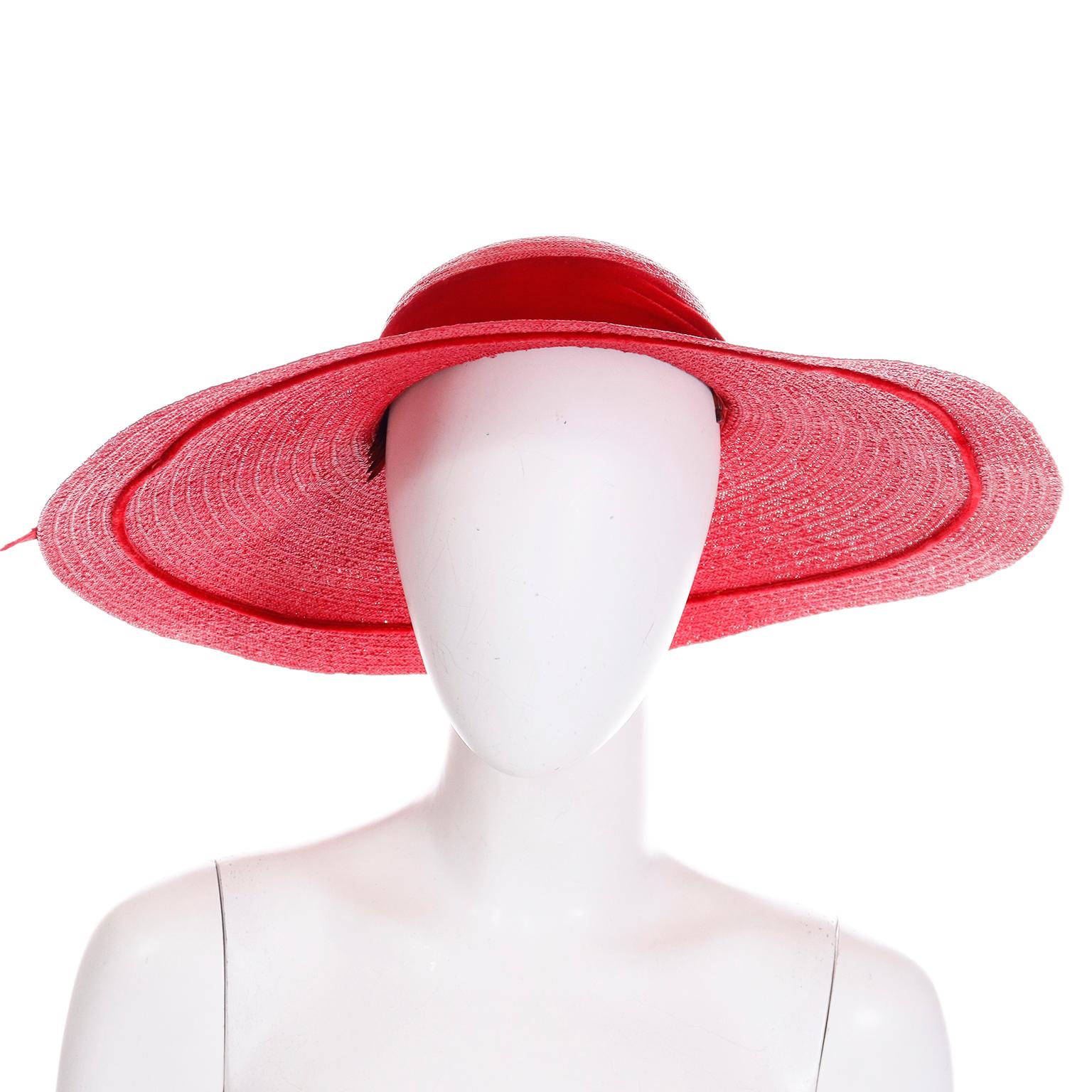 This is a lovely vintage 1940's Mr Leon the Milan King New York wide brim cherry red straw hat with a red velvet ribbon and bow. This hat has two labels; Mr Leon the Milan King New York and Joseph Magnin. We love the vintage late 1930's and early