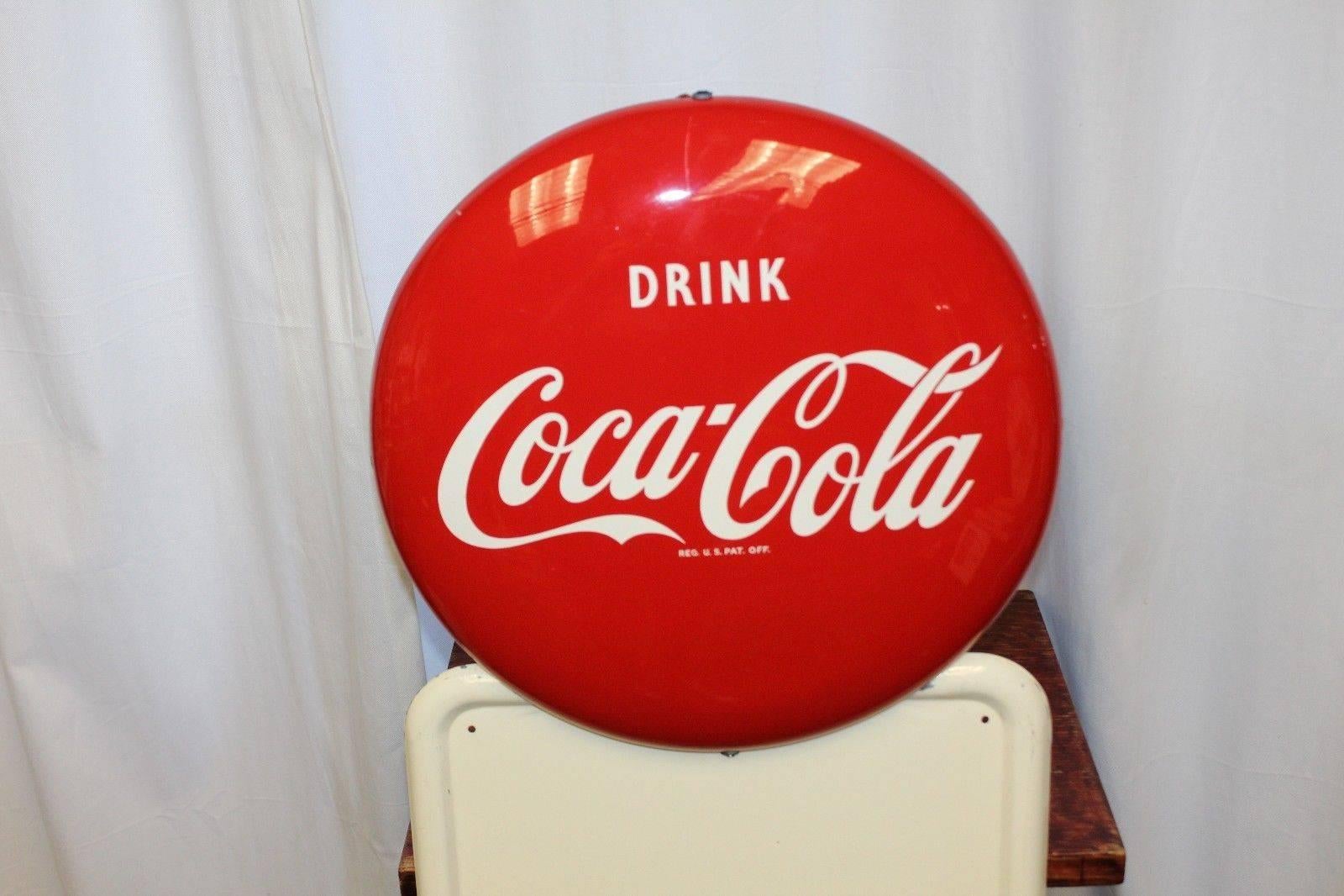 Original Coca Cola advertising made by AM Co. The Allen-Morrison Corporation who was best known for making the now iconic metal Coca-Cola signs. Allen-Morrison grew to become one of the largest sign manufacturers in North America. This is one of the