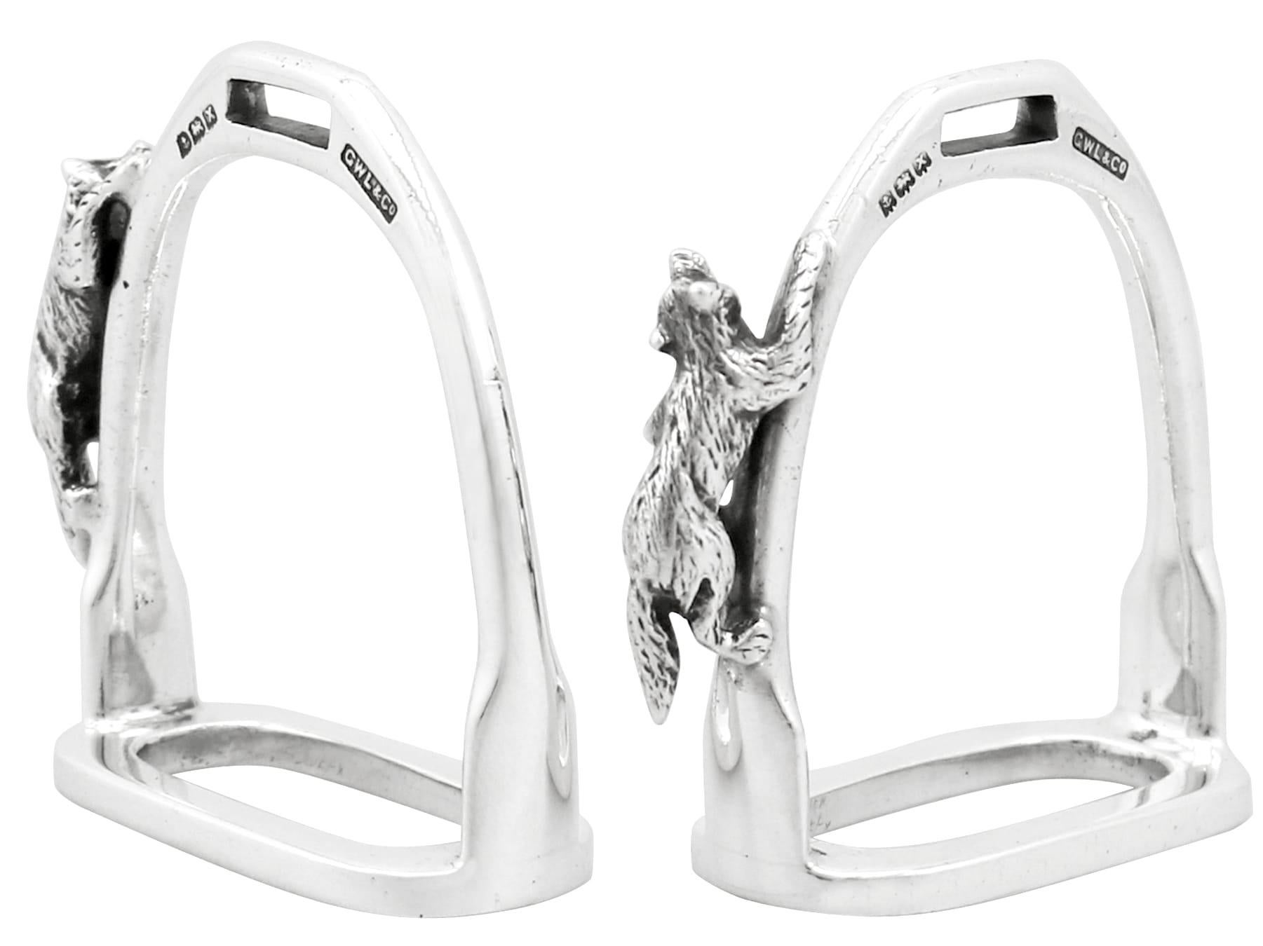 An exceptional, fine and impressive, pair of vintage George VI English sterling silver 'fox' napkin rings; an addition to equestrian related silverware.

These exceptional vintage George VI cast sterling silver napkin rings have been realistically