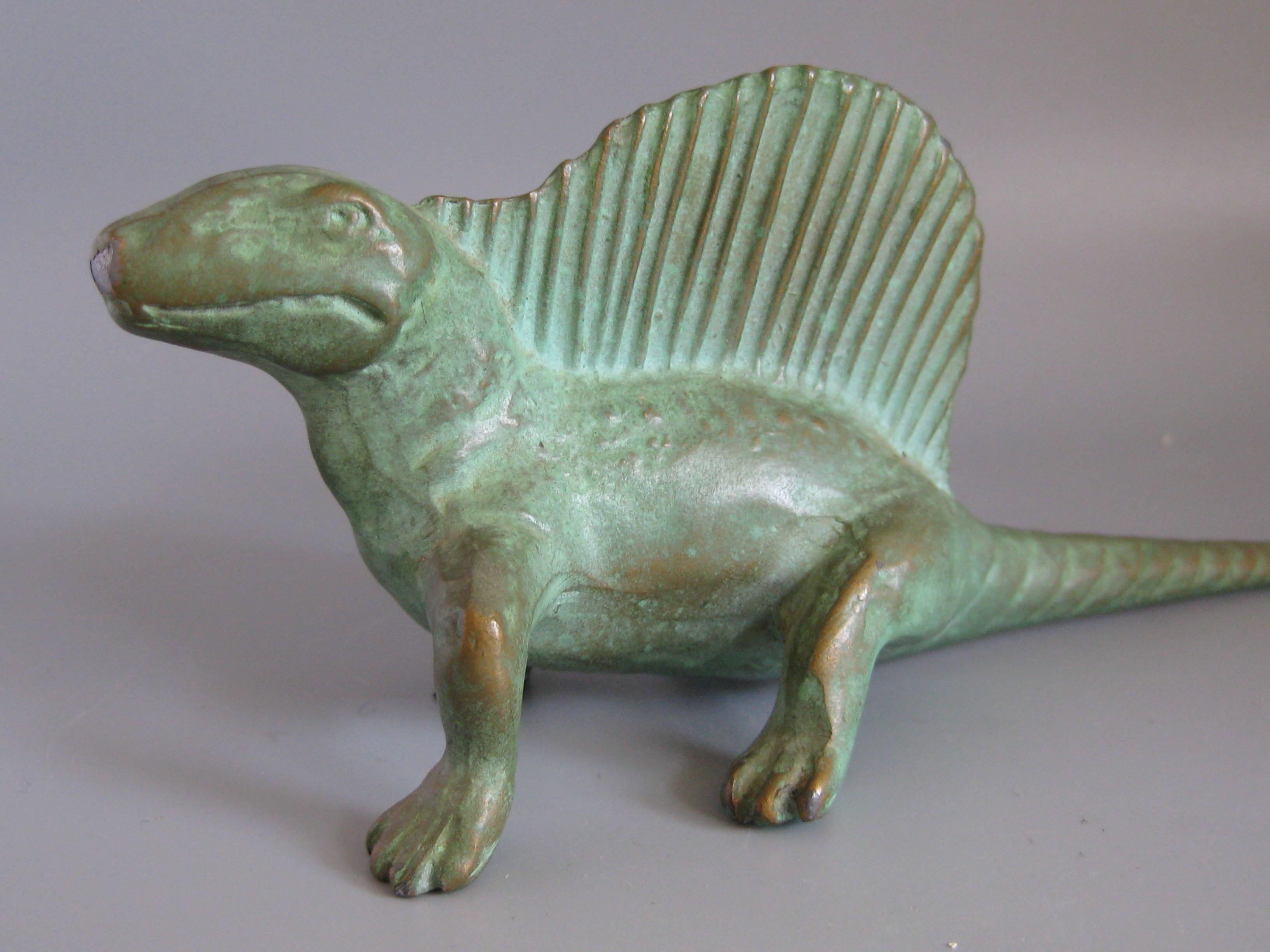 Great cast bronze Dimetrodon Dinosaur statue/sculpture dating from 1947. Marked on the bottom by the maker. Great details and wonderful patina. In excellent condition. Measures: Approximate 7
