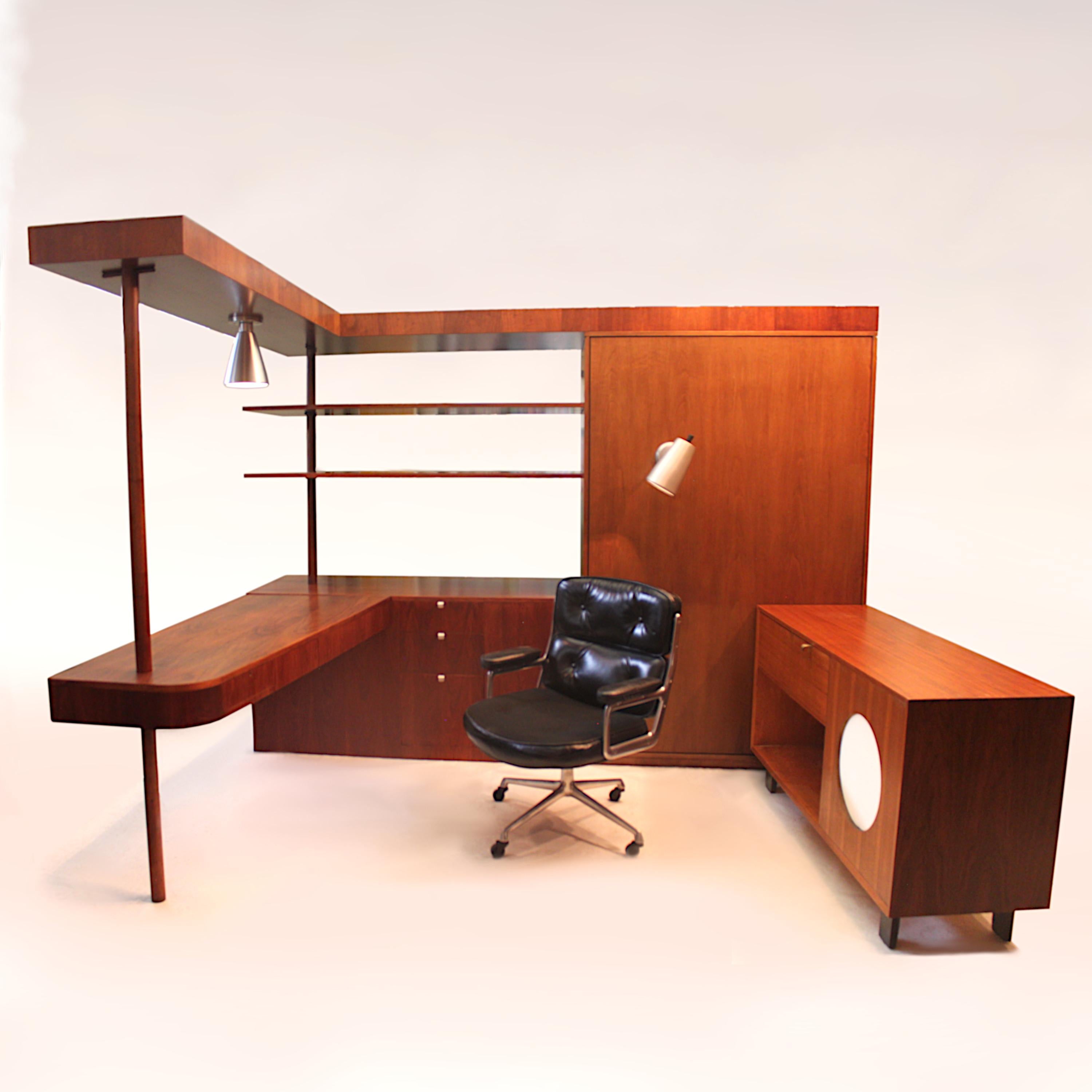 This remarkable piece is a one-off desk/wardrobe/bar/bookcase/storage cabinet custom-designed by George Nelson in 1949 to match his Basic Cabinet Series (BCS) for Herman Miller. The desk was made specifically for a client in the Promontory Apartment