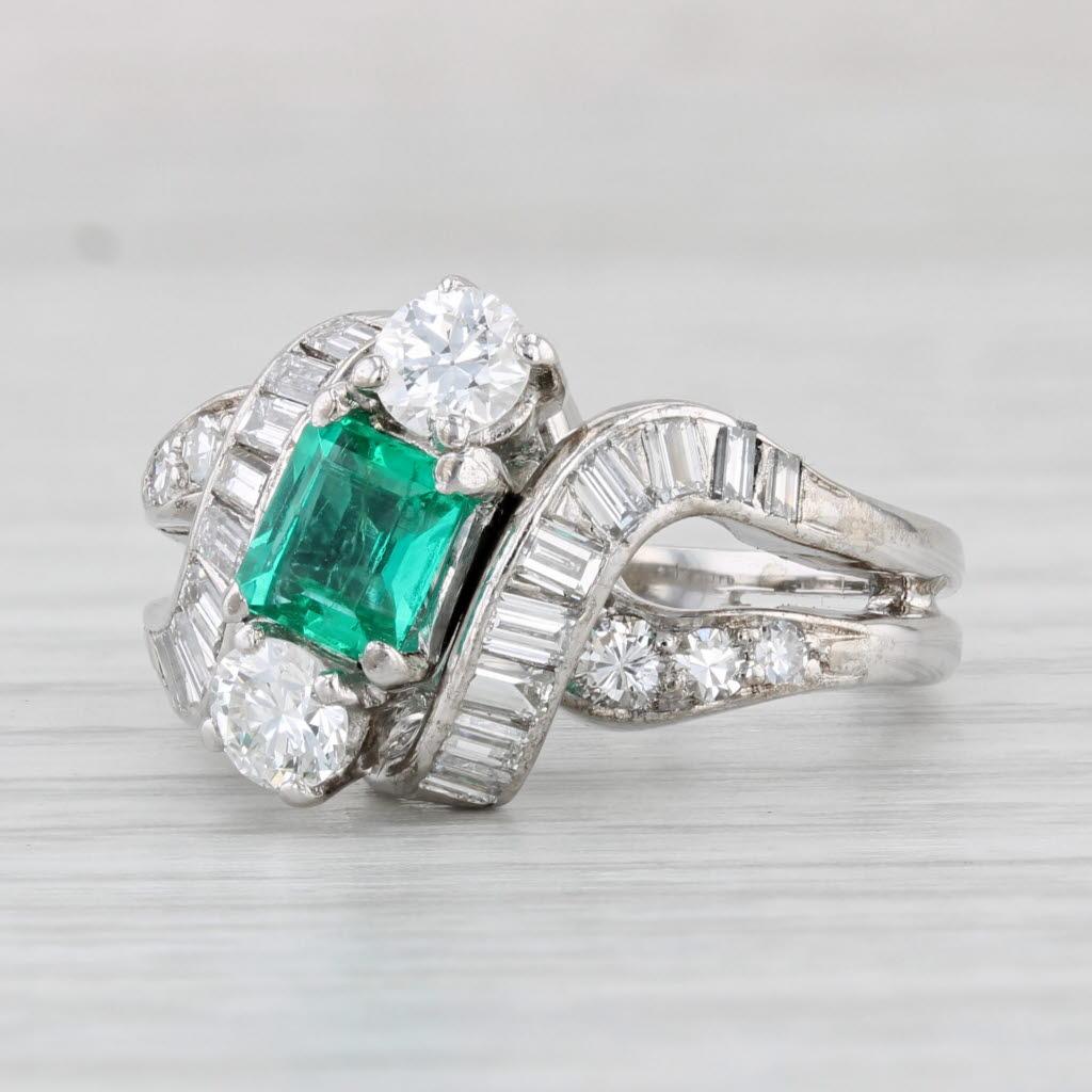 Gemstone Information:
- Natural Emerald -
Carats - 0.54ct 
Cut - Emerald Cut
Color - Green
Treatment - Oiling
Please note there is a bit of wear, surface reaching inclusions and tiny nicks

- Natural Diamonds -
Centers
Total Carats - 0.50ctw 
Cut -