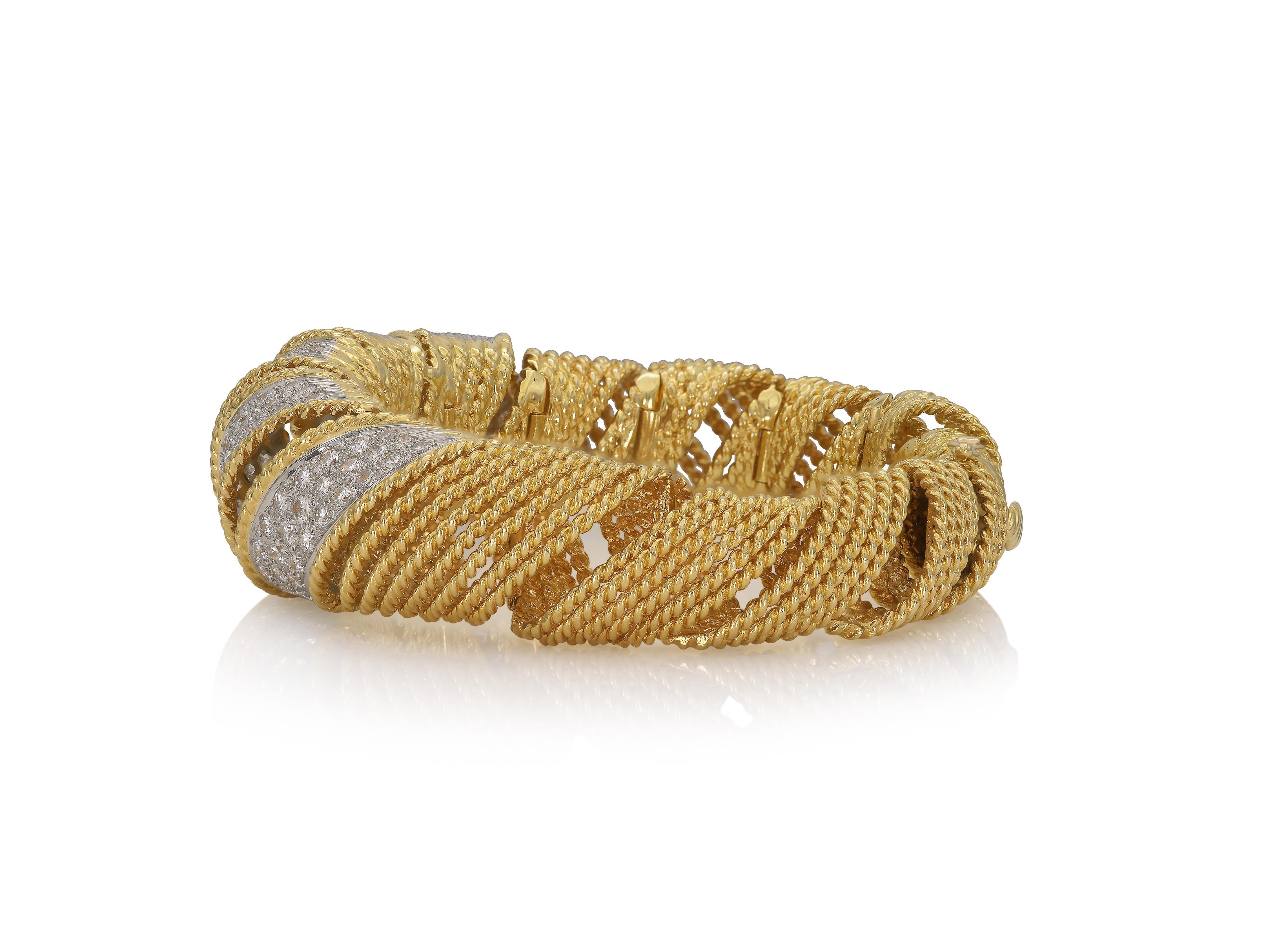 Finely crafted in 18k yellow and white gold with Round Brilliant cut Diamonds weighing approximately a total of 10.00 carats.
Circa 1950s
Size 6 inches