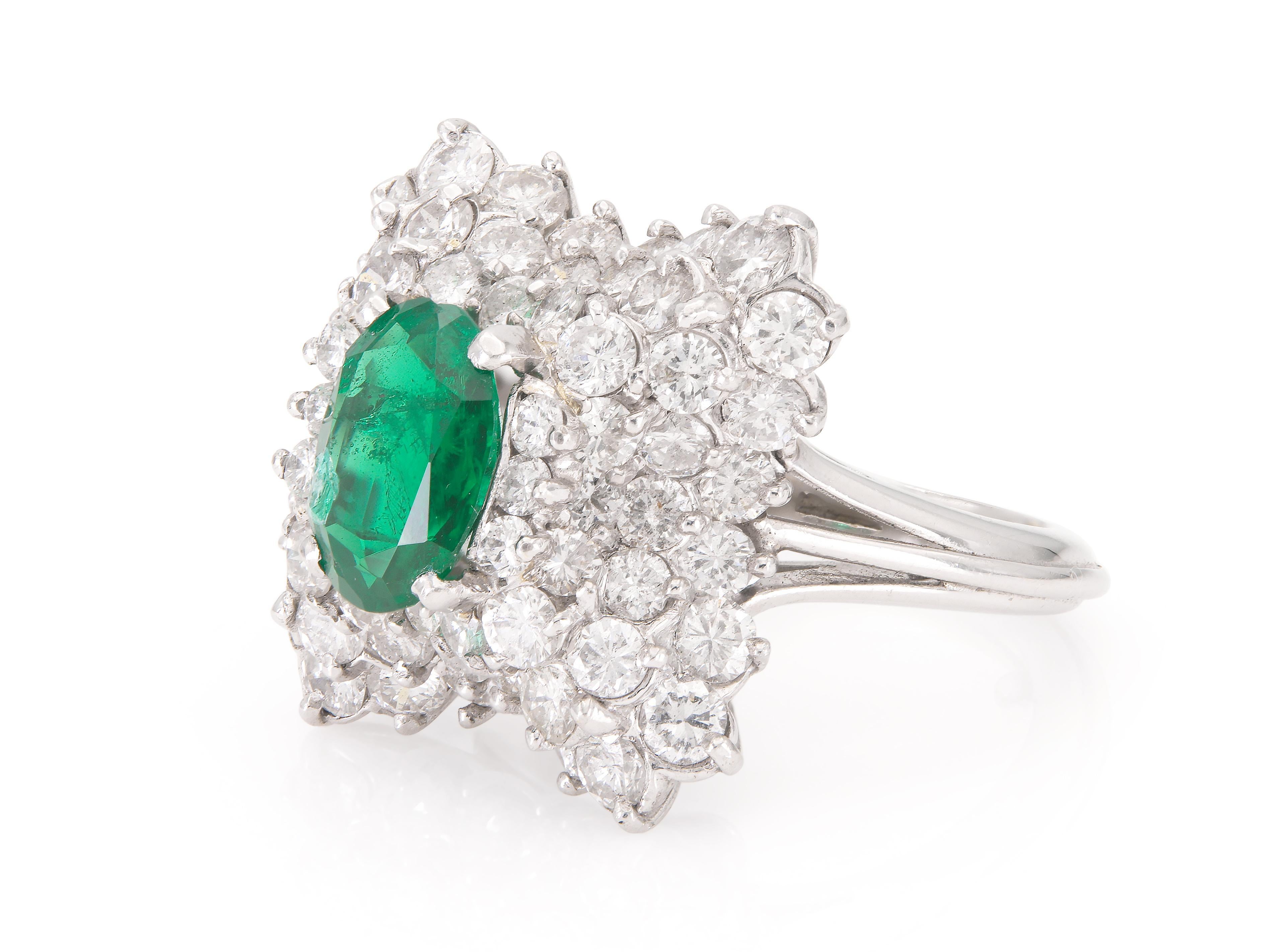 Finely crafted in platinum with an Oval cut Emerald weighing 1.38 carat set in a Ballerina setting featuring Round Brilliant cut Diamonds weighing approximately a total of 3.00 carats.
Circa 1950s
Size 4 1/2, resizable