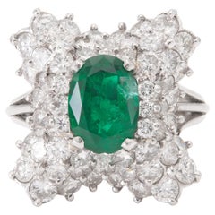 Vintage 1950s 1.38 Carat Oval Cut Emerald and 3.00 Carat Diamond Ballerina Ring