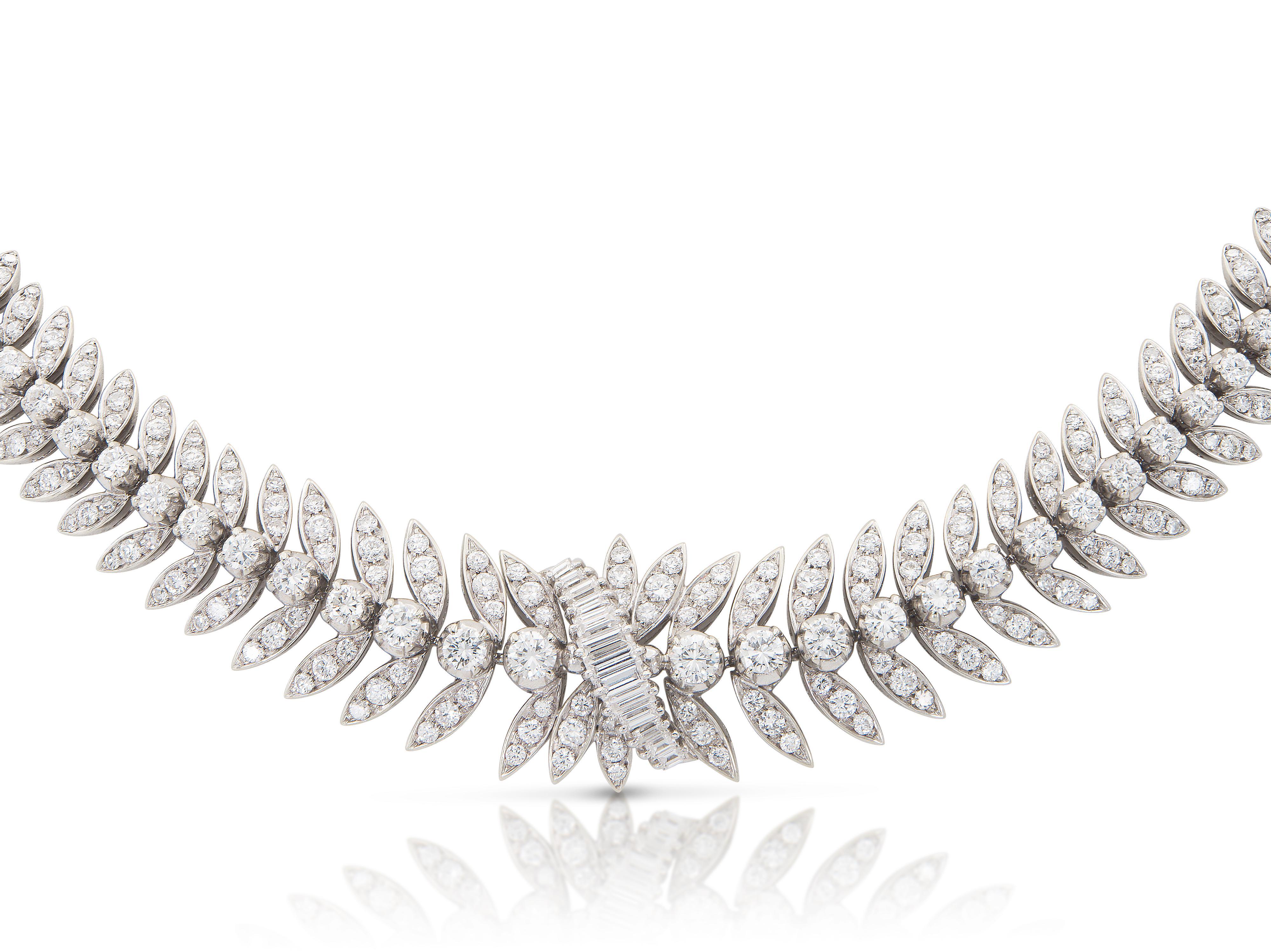 Finely crafted in platinum with Round Brilliant and Baguette cut Diamonds weighing approximately a total of 15.00 carats.
Circa 1950s
The necklace separates into a bracelet and an anklet.
Necklace: 16 1/2 inches
Bracelet: 7 1/4 inches
Anklet: 9 1/4