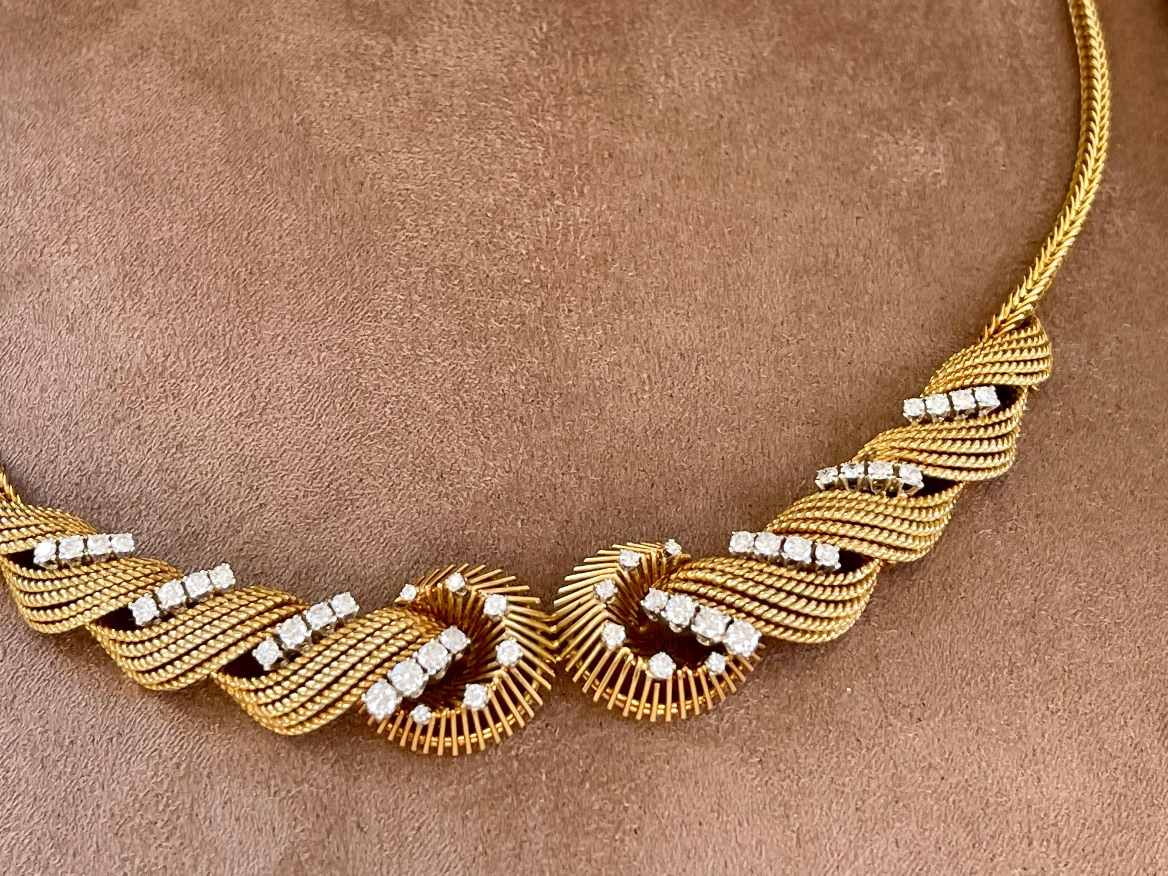 A mid twentieth century 18 K yellow Gold necklace of twist design accented with 44 brilliant cut diamonds weighing approximately 1.82 ct, G color, vs clarity.  Length ca. 43 cm. 
Weight: 41.63 grams. Signed Bucherer Switzerland. 
Masterfully