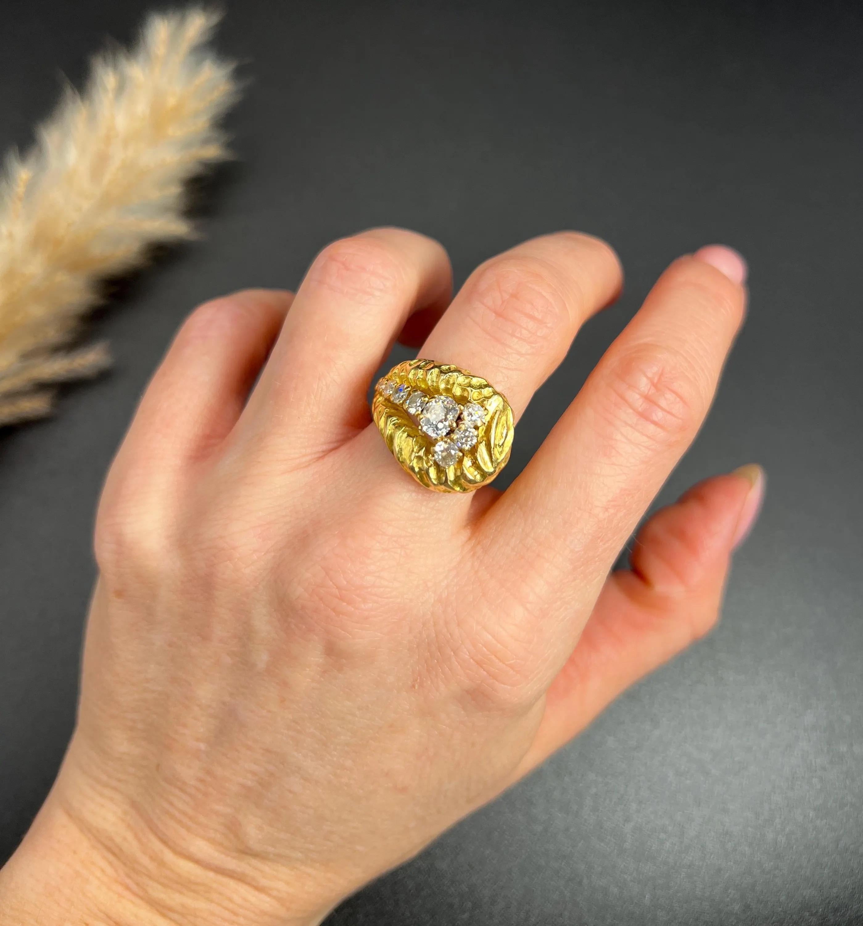 Vintage Gold Buckle Ring 

18ct Yellow Gold French Hallmarked

Circa 1950s

Introducing a stunning 18ct yellow gold buckle ring that beautifully combines elegance and craftsmanship. This fabulous ring features a unique hammered finish, lending it a