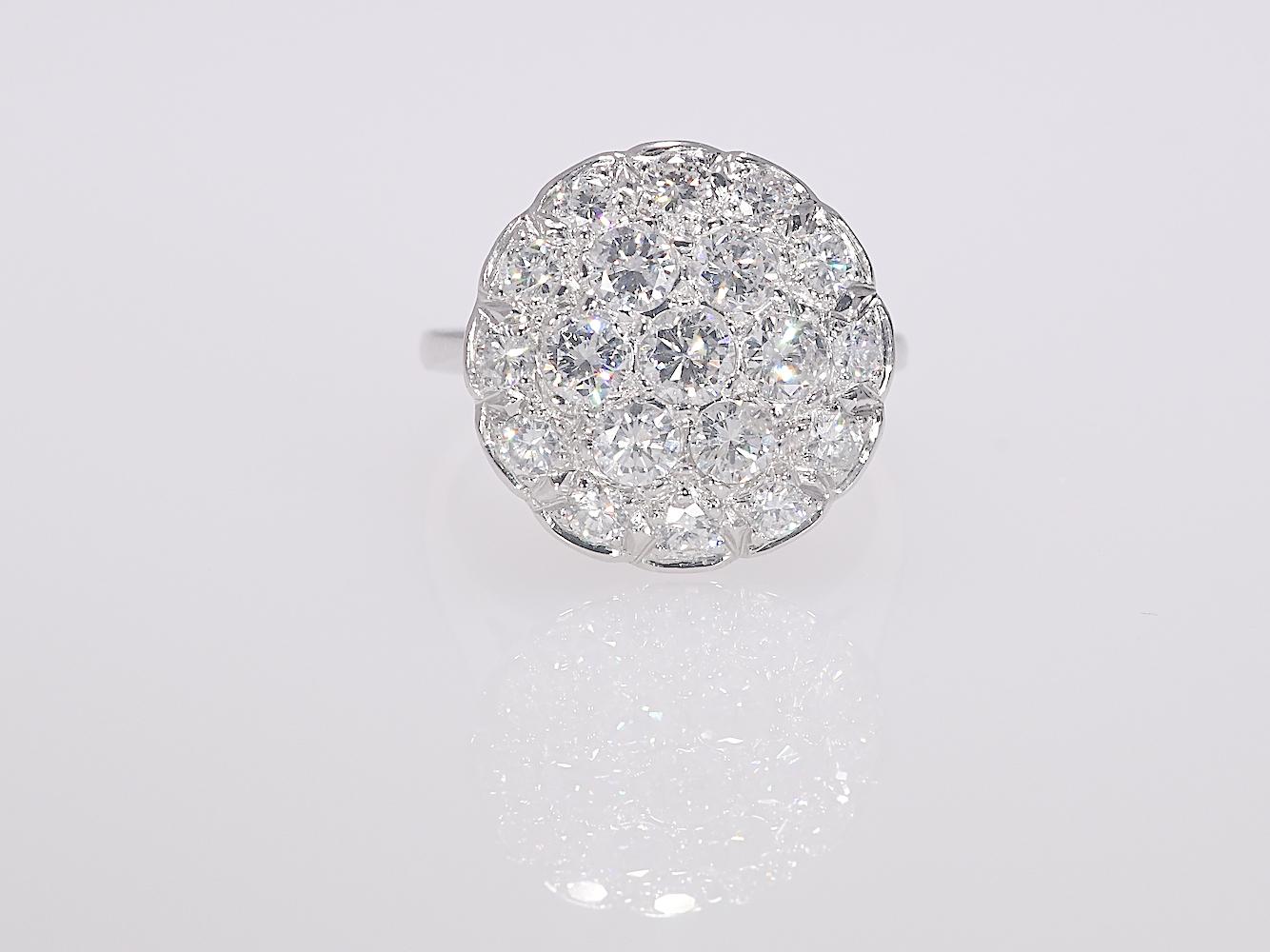 2 CTW Vintage Circular Cluster Natural Diamond Ring White Gold 14K 4.50 grams

Era: 1950's 
Stones: Natural Diamonds   TCW: 2.0    Color: GHI   Clarity: SI2-I2   Cut: Round
Metal: White Gold 
Purity: 14K 
Style: Round Cluster Ring
Finger Size 7 1/4