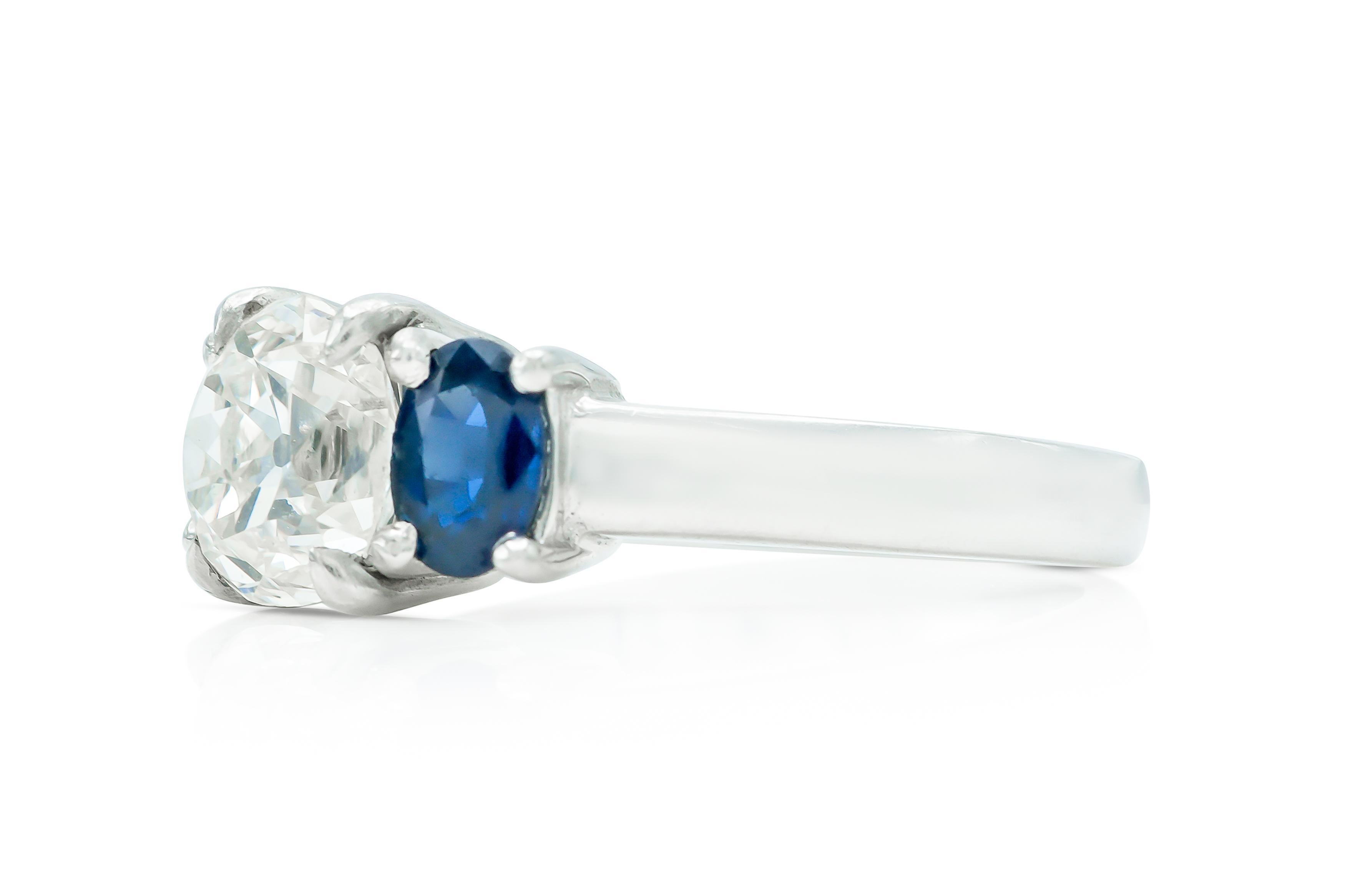 Finely crafted in platinum with an Old Mine cut Diamond weighing approximately 2.30 carats, K color, VS2 clarity, and 2 Oval cut Sapphires weighing a total of approximately 0.80 carat.
Circa 1950s
Size 7 1/4, resizable