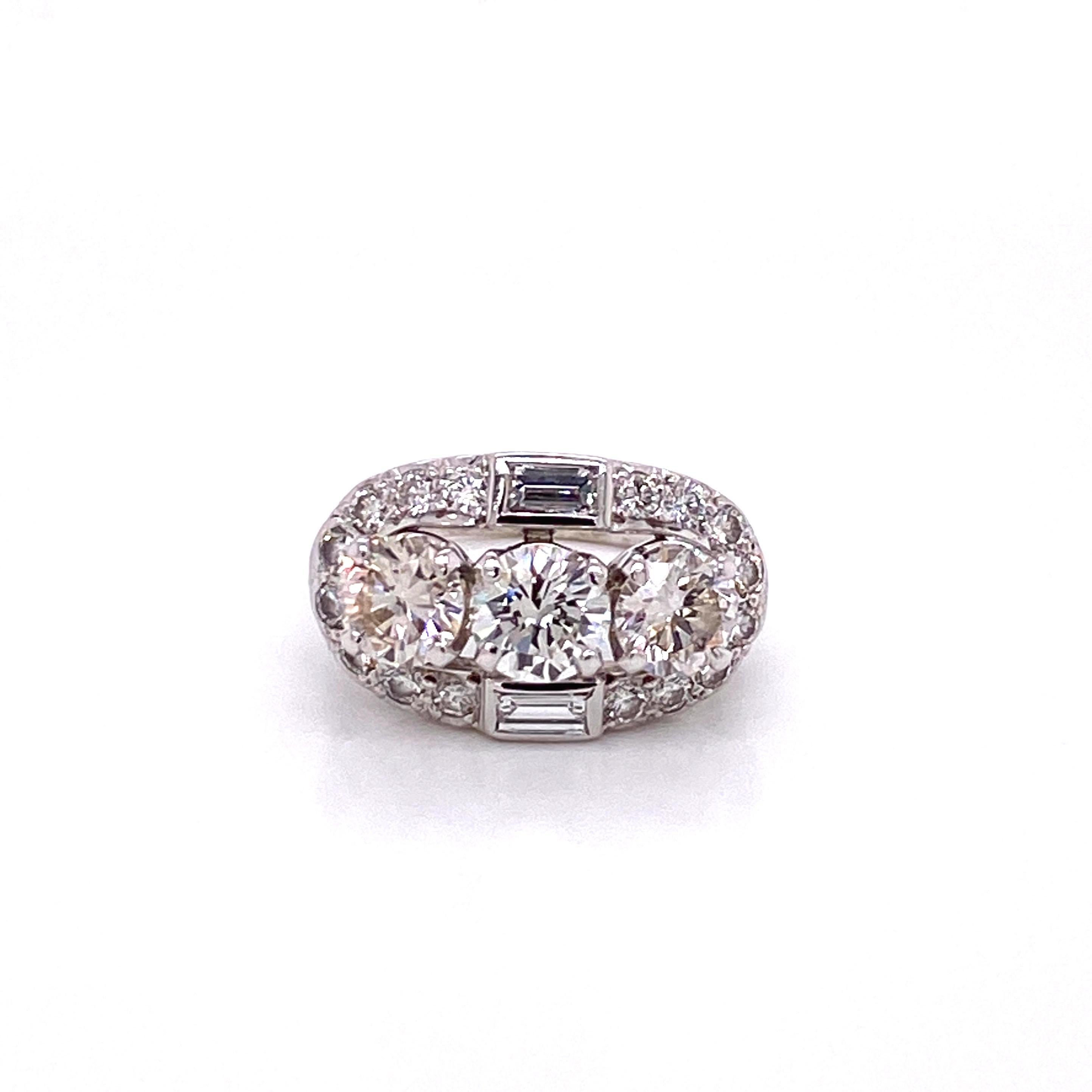 Vintage 1950s Retro 3 Stone Diamond Ring - The center 3 round diamonds are approximately .85ct each for a total weight of approximately 2.50ct. The diamonds are J-K color and VS1-VS2 clarity. Surrounding the 3 diamonds are 16 full cut diamonds and 2