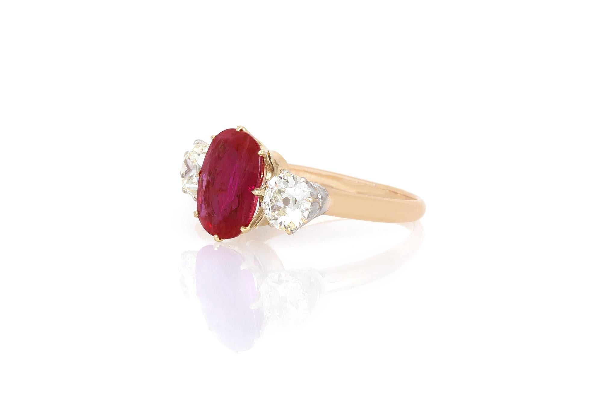 Finely crafted in 18K yellow gold and platinum with an Oval cut Burma origin Ruby weighing approximately 3.00 carats, and two Old European cut Diamonds weighing a total of approximately 2.25 carats.
Circa early 1950s
Size 7 1/4, resizable