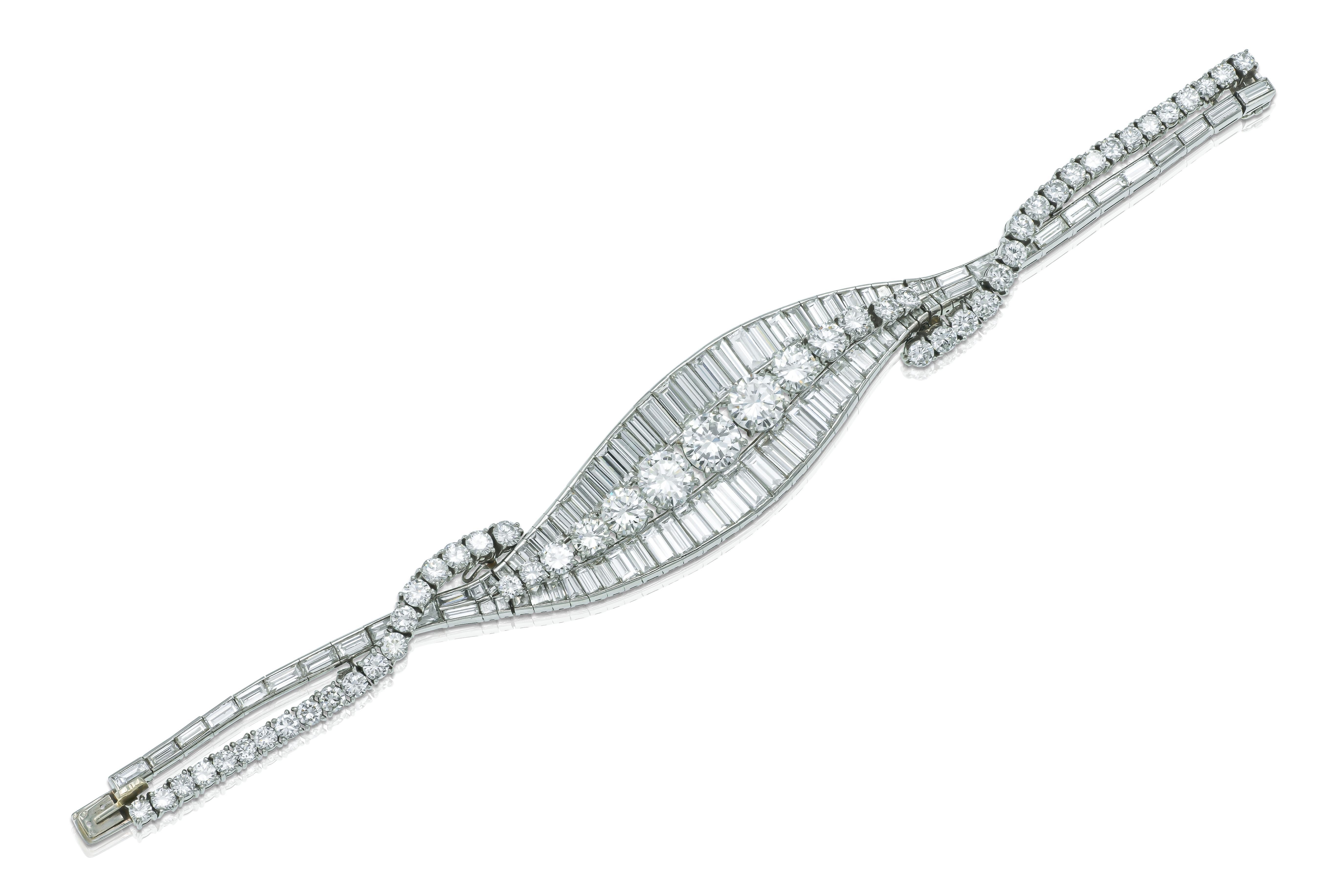 Finely crafted in platinum with a Round Brilliant cut center Diamond weighing 1.75 carat, additional Round Brilliant cut Diamonds weighing approximately a total of 15.00 carats, and Baguette cut Diamonds weighing approximately 30.00 carats
Circa