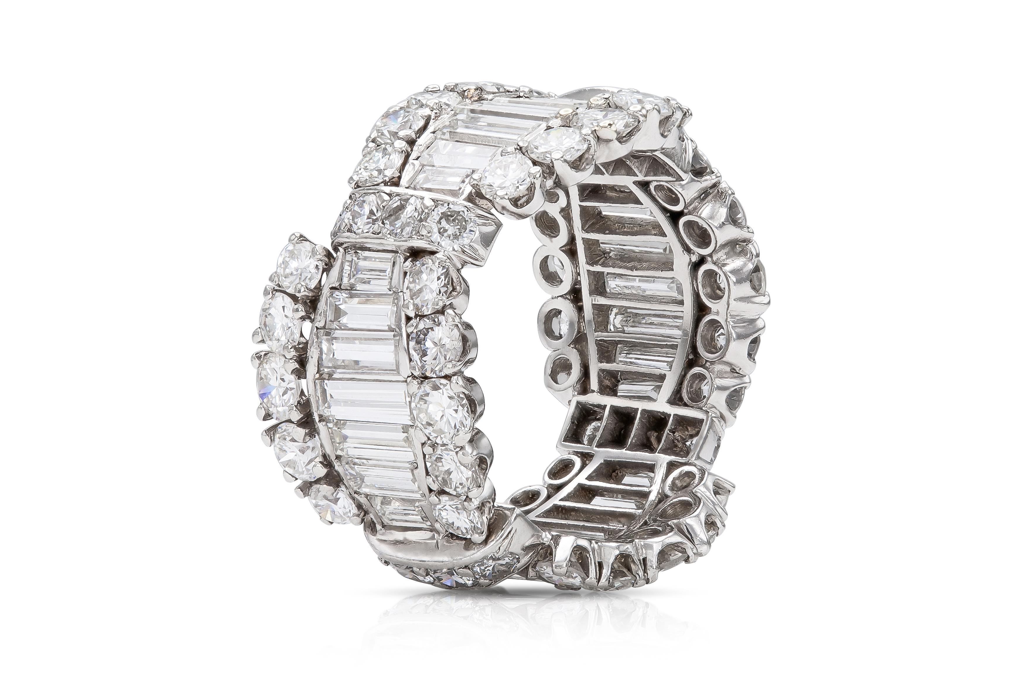 Finely crafted in platinum with Round Brilliant and Baguette cut Diamonds weighing approximately a total of 6.00 carats, G-H color, VS1-VS2 clarity.
Circa 1950s
Size 5 1/2