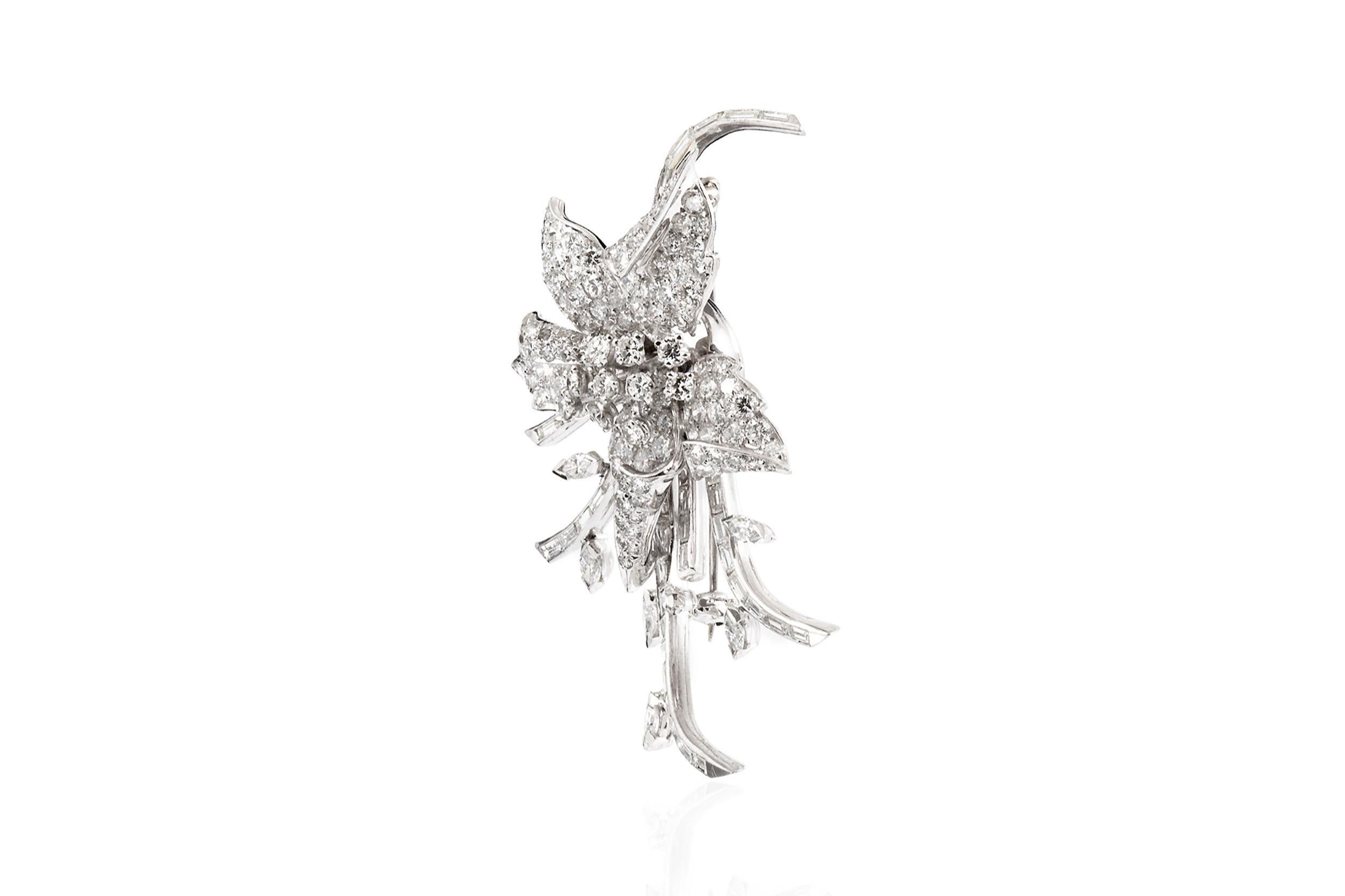 Finely crafted in platinum with Round Brilliant,  Baguette, and Marquise cut Diamonds weighing a total of approximately 7.00 carats. 
Circa 1950s
2 3/8 x 1 7/16 inches