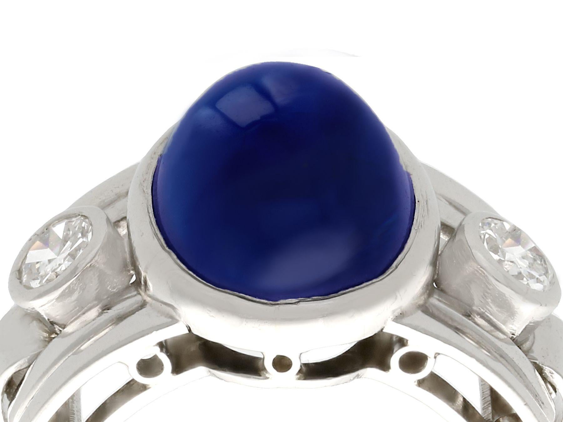 A stunning, fine and impressive vintage 7.62 carat blue sapphire, 0.60 carat diamond and platinum cocktail ring; part of our diverse vintage jewelry collections.

This stunning, fine and impressive 1950s cabochon cut sapphire cocktail ring has been