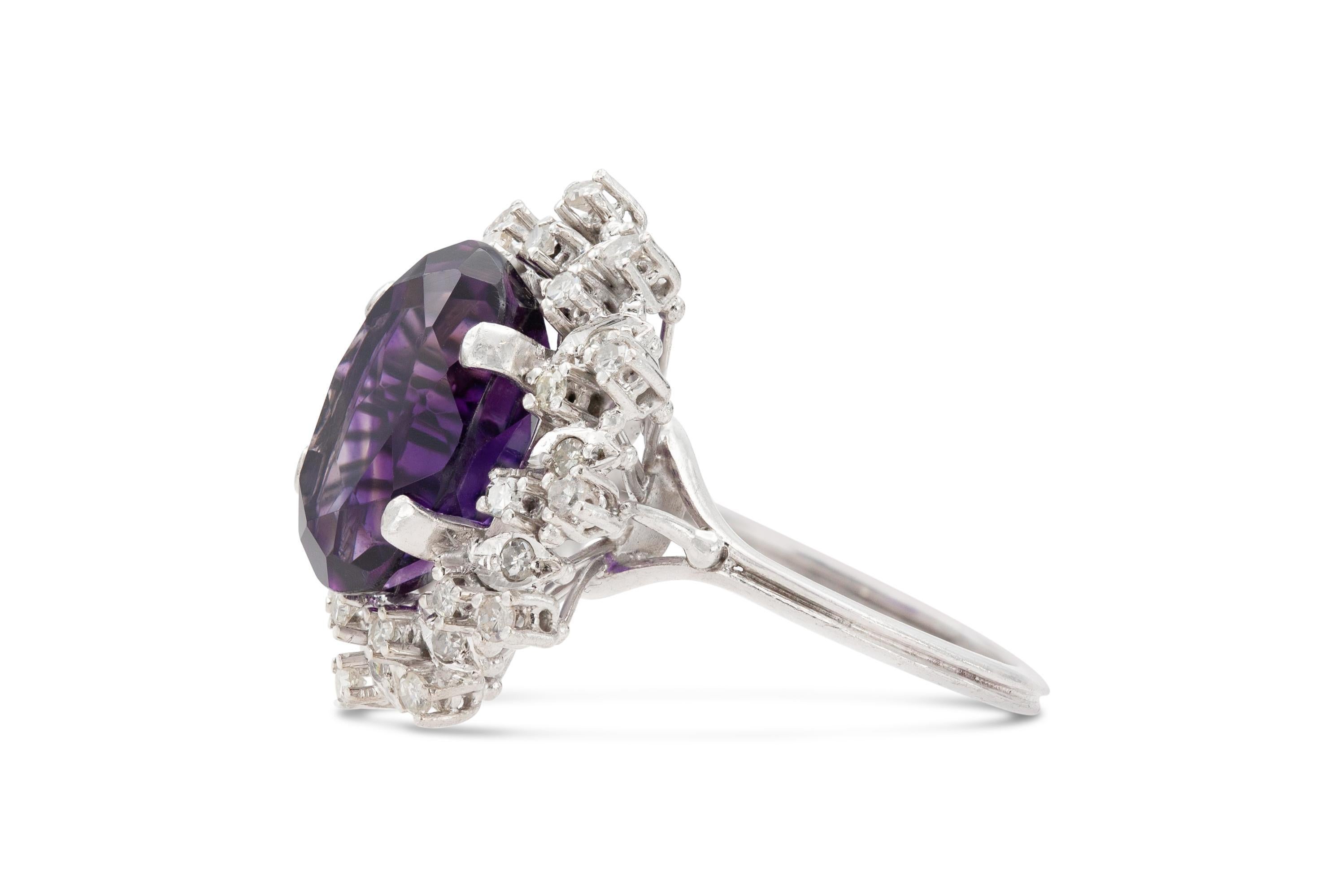 Finely crafted in 18k white gold with an Oval cut Amethyst weighing approximately 8.00 carats surrounded by Single cut Diamonds weighing approximately a total of 1.50 carat.
Circa 1950s
Size 8 1/2, resizable