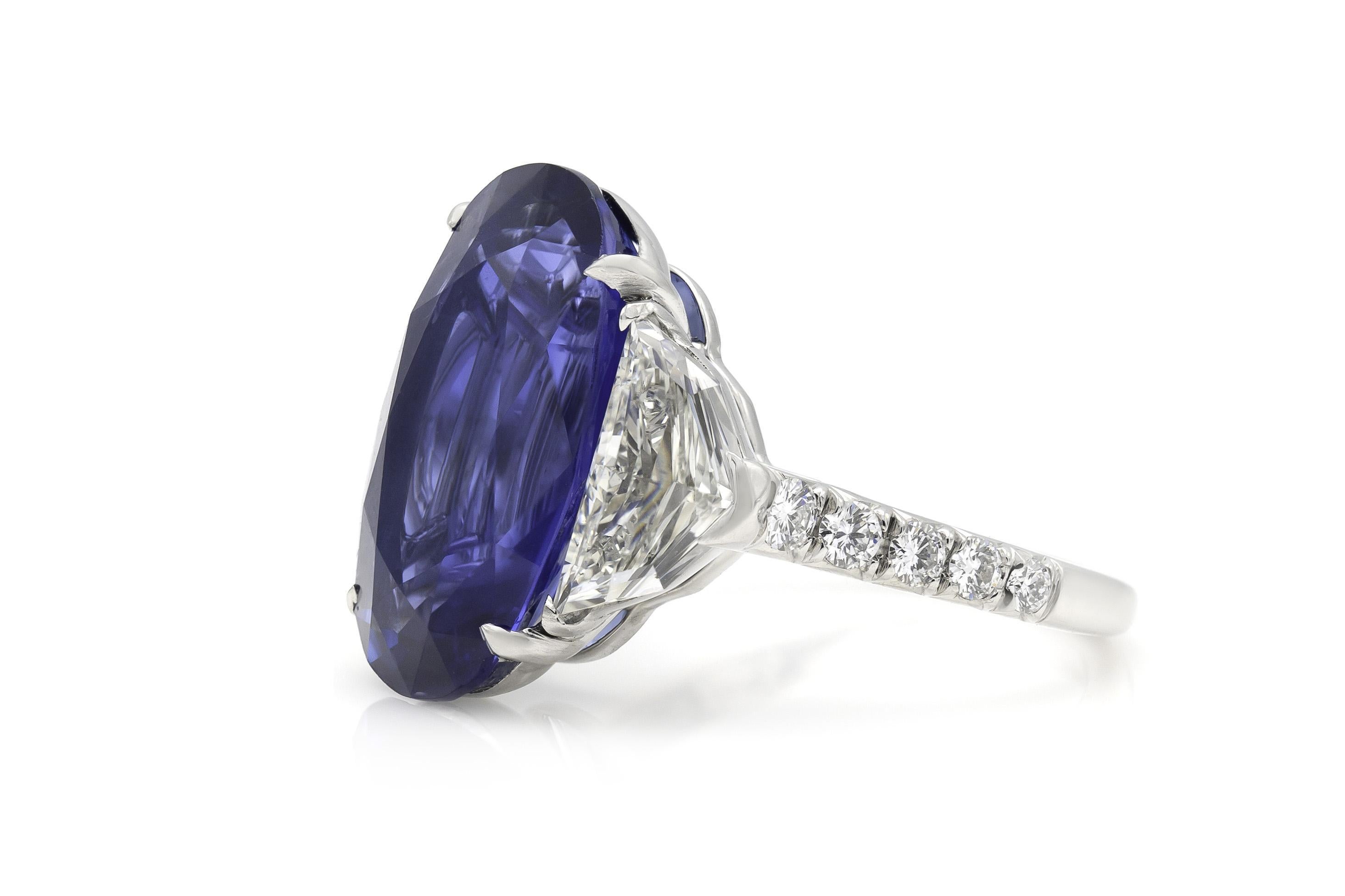 Finely crafted in platinum with an AGL and GRS certified, Burma origin, not-heat treated, Oval cut Sapphire weighing 9.78 carats, accented by a pair of Shield cut Diamonds weighing a total of approximately 1.68 carats. The ring features Round