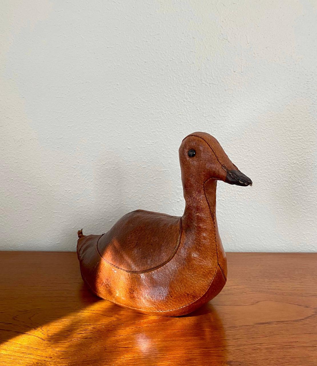 Vintage Abercrombie & Fitch duck. A folk crafted, hand stitched leather accent piece. Grain sack weighted with black beak. Some wear and patina to leather.