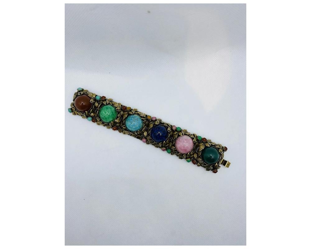 Vintage 1950's Cabochon Glass Leaf Pattern Wide Bracelet 
Condition in overall good and wearable condition some wear to the back of the bracelet consistent with age and wear please see photos 
size is approximately 7 inches long by 1 ½ inches