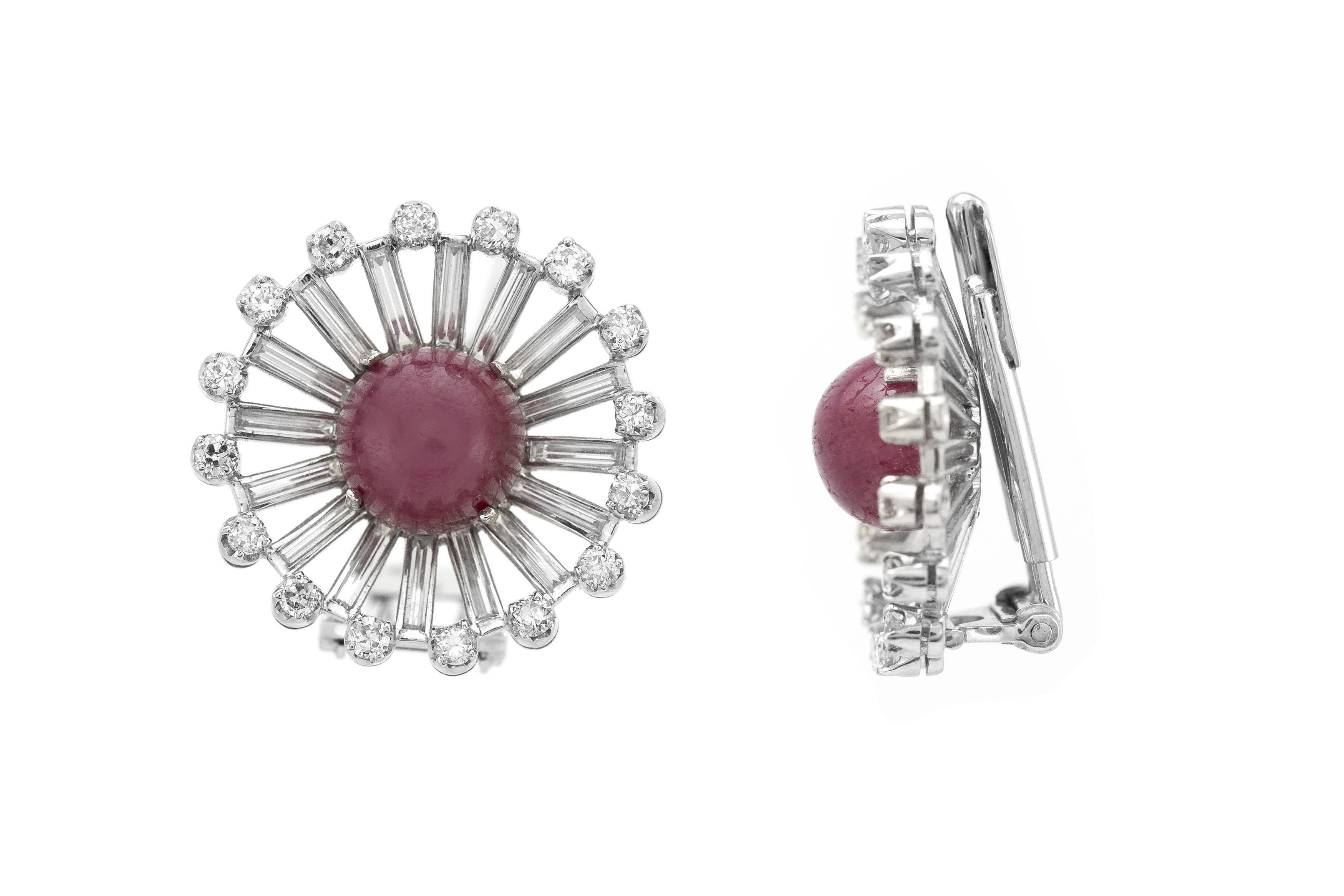 Finely crafted in platinum with two Cabochon Rubies and Round Brilliant and Baguette cut Diamonds weighing a total of approximately 5.50 carats.
Circa 1950s
1 inch diameter
Can be worn as earrings or 2 separate brooches