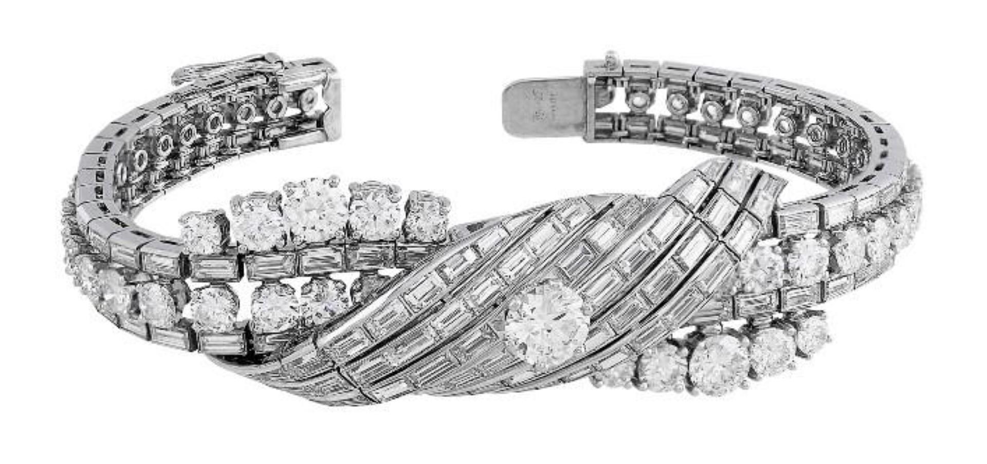 Stunning vintage circa 1950's Cartier Platinum Diamond Bracelet. Platinum bracelet, set with 46 brilliant cut and 135 baguette cut diamonds.