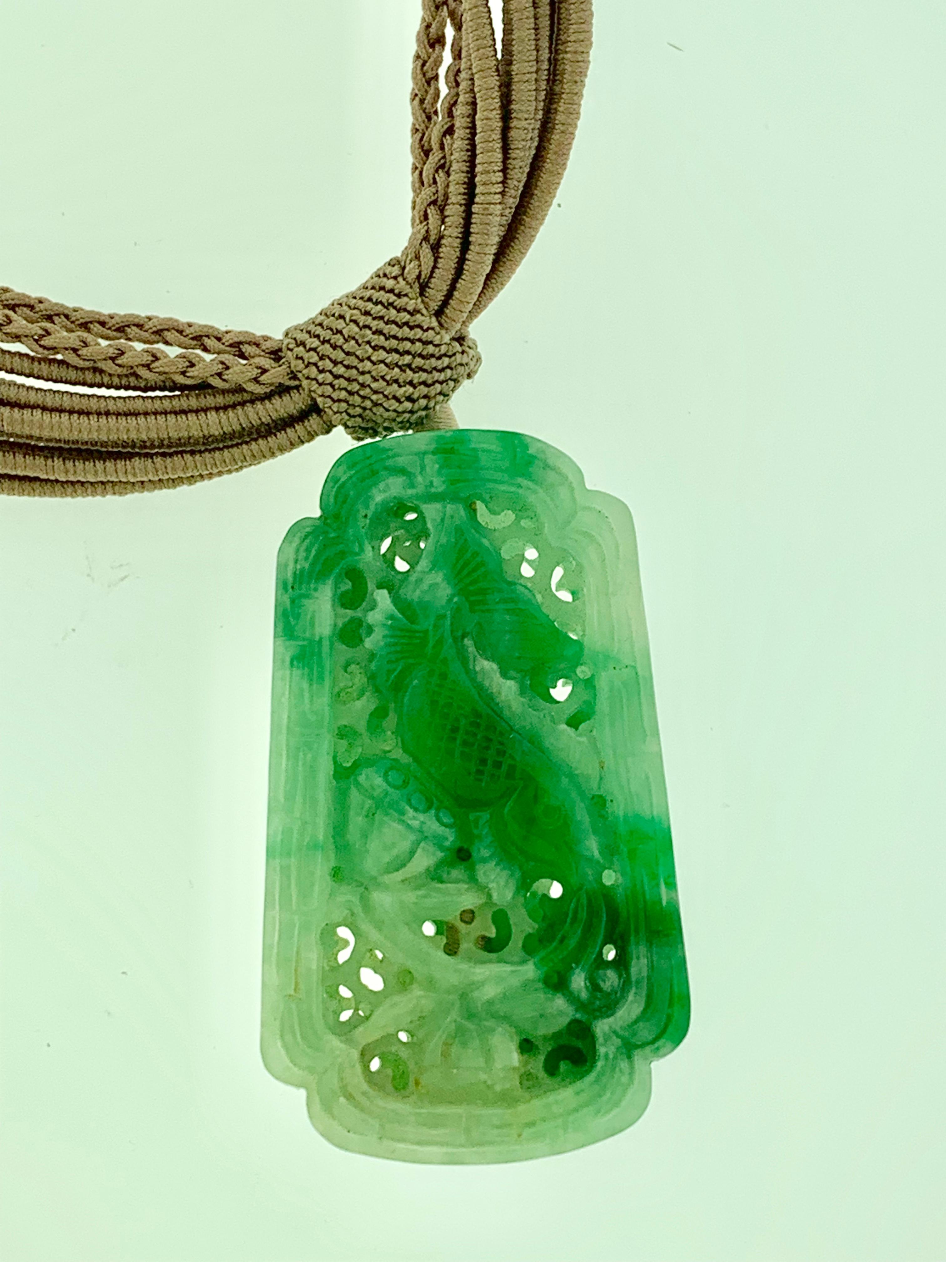 Vintage 1950s Carved Double Sided Highly Pierced Large Pendant Jade Necklace In Excellent Condition In New York, NY