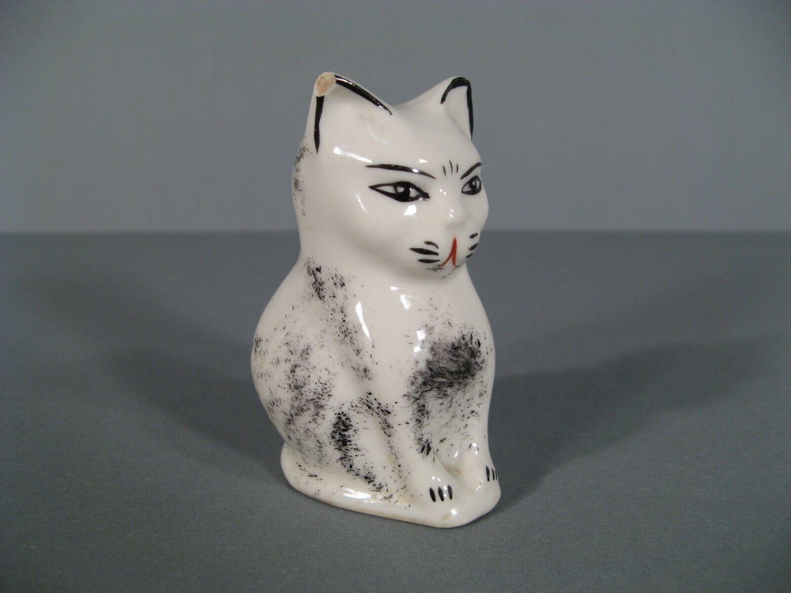 This charming vintage ceramic salt shaker, designed in the shape of a sitting cat, dates back to the 1950s. It’s a delightful collectible item that adds a touch of whimsy to any kitchen or display.

Product Details:

Era: 1950s
Material: